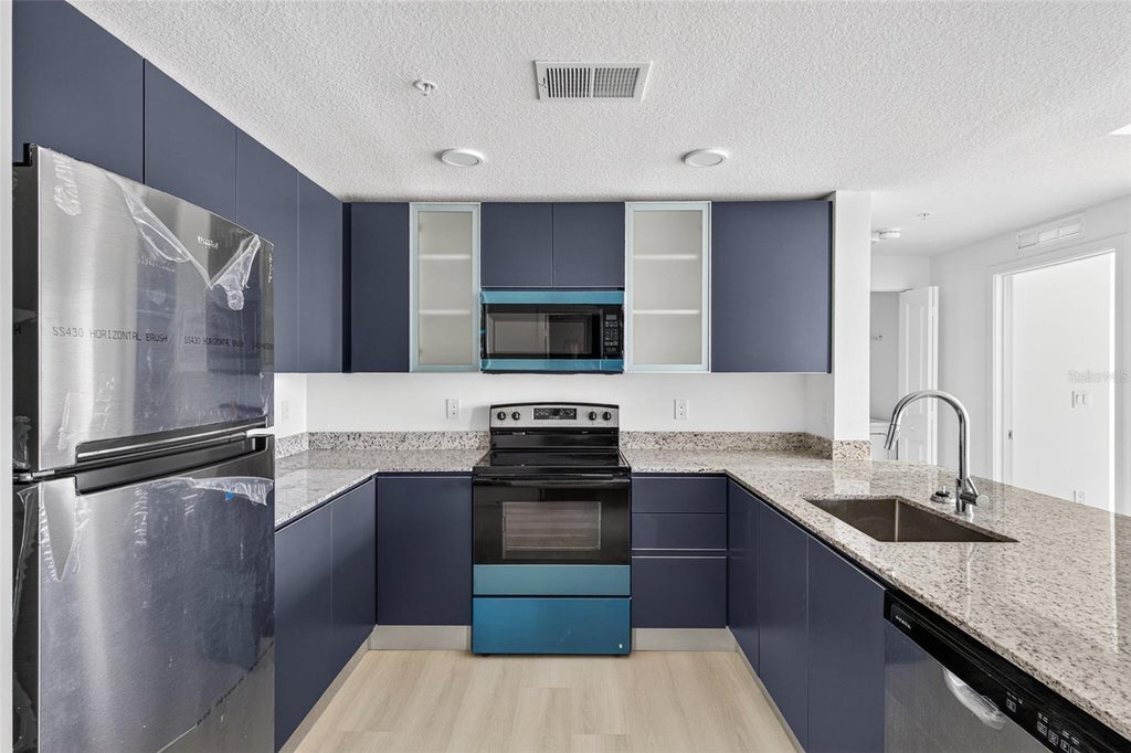 Photo of 5563 Millenia Park Blvd #417, Orlando, FL 32839 (MLS # O6445645)