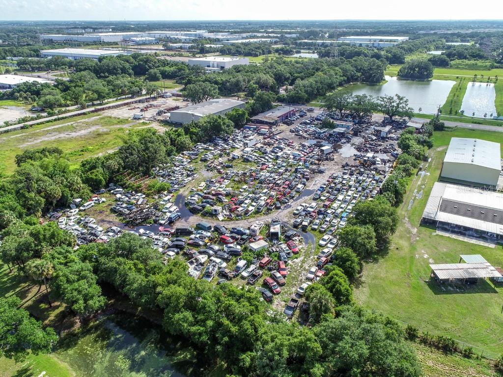 Priced to sell this Amazing 4.73 acres of Heavy industrial Commercial site is an Opportunity Zone M (commercial, office, industry in Riverview Fl. This shop has been in business for over 15 years as a Mechanic Shop Salvage yard, Import and export license (Grandfathered) w/container loading ramps. Tire shop, Car dealership zoned and approved. shop comes with paint booth and fire system. & 1000-gallon waste oil collection drums on-site. 50% of land is concrete.