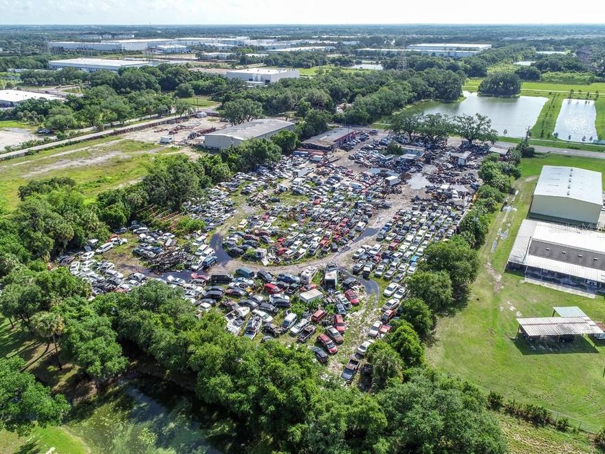 Priced to sell this Amazing 4.73 acres of Heavy industrial Commercial site is an Opportunity Zone M (commercial, office, industry in Riverview Fl. This shop has been in business for over 15 years as a Mechanic Shop Salvage yard, Import and export license (Grandfathered) w/container loading ramps.  Tire shop, Car dealership zoned and approved. shop comes with paint booth and fire system. & 1000-gallon waste oil collection drums on-site. 50% of land is concrete.