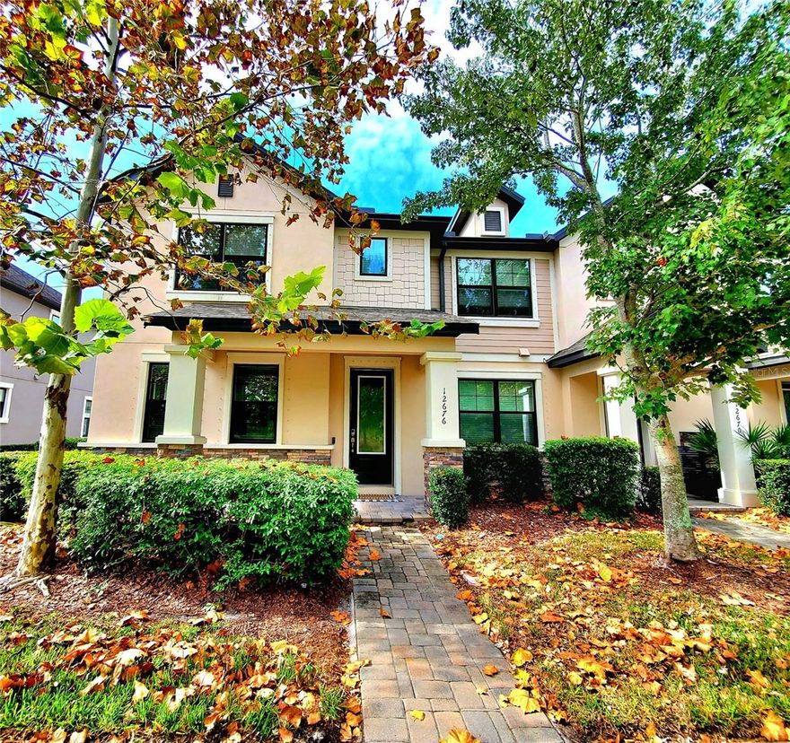 ** STARKEY RANCH TOWNHOUSE! ** Welcome to the charming village of Starkey Ranch! Filled with woods, parks, ponds, and trails, Starkey Ranch has quickly become a sought-after destination! This low-maintenance townhouse, like the beautiful neighborhood, won’t disappoint! Built in 2019, it still feels nearly brand new and is move-in ready from top to bottom. This end-unit home offers the feel of a single-family house, featuring a brick paver front porch and a rear 2-car garage. Surrounded by maple trees, pines, and lakes, the community pool and Cunningham Park are just a short walk away! Inside, the open floor plan includes a great room and kitchen combo, ideal for casual living. The spacious family room even comes with its own 70-inch flat screen TV! The gourmet kitchen boasts a center island, 42-inch upper cabinets, and a gas stove, smart fridge & oven, along with additional cabinets and a walk-in pantry with custom built-ins for extra storage. Laminate wood-style flooring runs throughout the home, with ceiling fans and window blinds in every room. Double French doors open to a downstairs office that could also serve as a cozy den. The staircase features motion sensor lighting for nighttime convenience. Upstairs, you’ll find all three bedrooms, including the master suite. The master bedroom offers a private bathroom and a walk-in closet with built-ins for added storage. The master bath features a glass walk-in shower. Two additional bedrooms share the second upstairs bathroom. The laundry room is conveniently located upstairs and includes a washer, dryer, storage cabinets, and a stainless steel utility sink. A third bathroom and another storage closet are located downstairs. With plenty of closet space, the 2-car garage also includes overhead shelving for even more storage. Additional features include a tankless water heater, smart garage door, water softener, and hurricane shutters. Love the outdoors? Enjoy the brick courtyard patio, which is screened and perfect for relaxing!