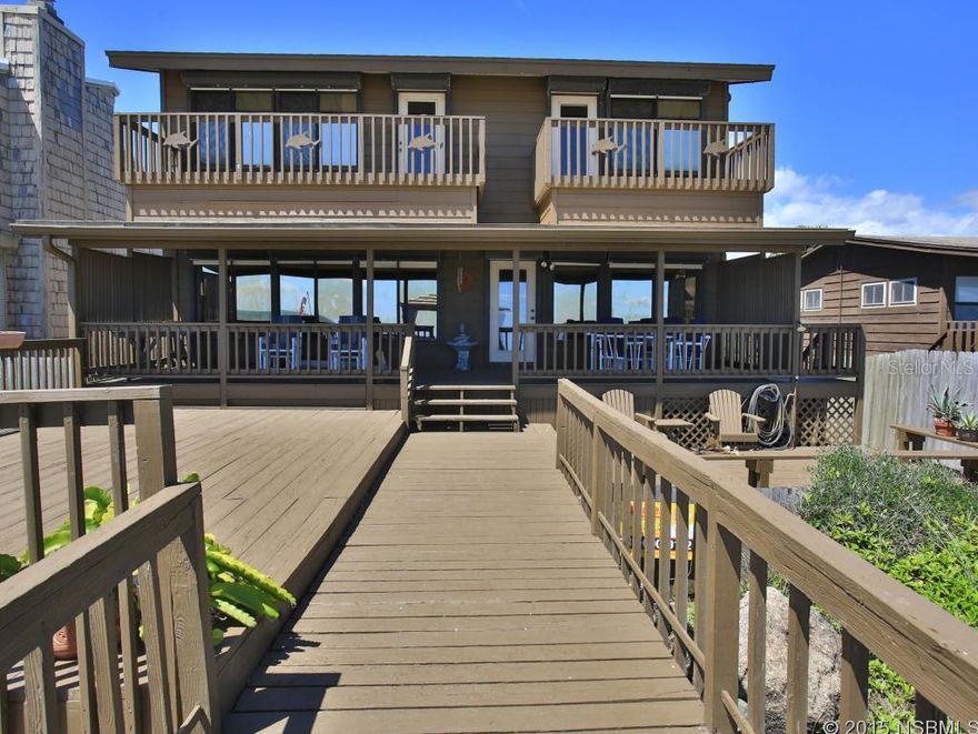 What a great beach house! 3 stories of home to roam,  and with 4BR/4BA there's room for the whole family, plus friends.  Great room main floor with open DR & remodeled kitchen with solid wood cabinets and new SS appliances. Tile countertops, plenty of cabinets with a dry bar with power. Huge covered deck opens out to very large multi level decks & covered Tiki hut hanging over the dunes.  Brand new patio furniture to sit and enjoy the waves under your feet. 1BR/1Ba on this level. Upstairs are 2 master suites with sliders out to each private deck overlooking ocean.  Nice roomy master bath with tub and shower. First floor is den, 1 BR 1 BA, laundry and garage. Tongue and groove wood walls and cathedral ceilings give that cool shady feel. Each level has its own AC system, all 3 replaced 2013.  New furnace 2011.  Doors to exterior downstairs could allow for in-law quarters. New paint on exterior May 2015. Well maintained and loved home could be yours! ;Water: City