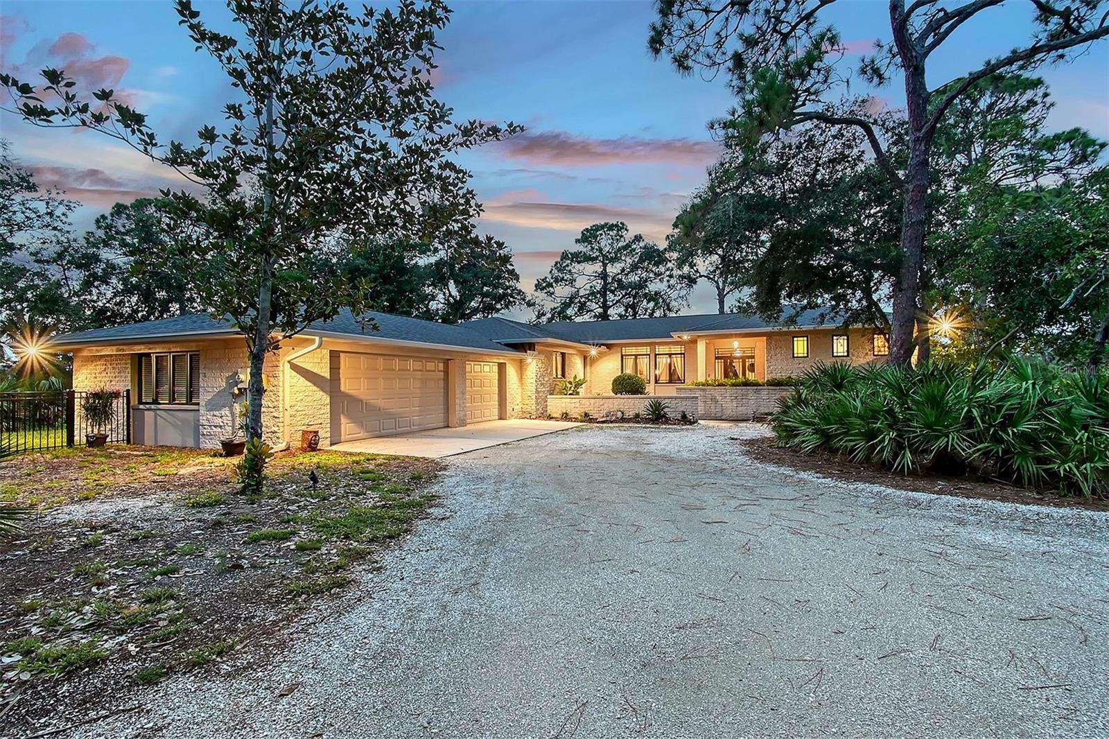 Tucked away in the exclusive and serene enclave of River Forest, 5935 River Forest Circle offers an unparalleled lifestyle defined by privacy, nature, and the quiet luxury of riverfront living. Set on 1.44 lush acres where the Braden River and Williams Creek gently converge, this custom-built estate is "close to everything, yet so far away." Just minutes from dining, shopping, I-75, and downtown Bradenton, you'll feel worlds apart as you arrive down a private winding drive shaded by native pines and oaks.
This expansive brick residence has been meticulously updated with thoughtful enhancements, including a brand new A/C system (2024), new roof (2023), and new plush carpeting in the bedrooms for added comfort. The home’s striking interior showcases gleaming marble floors, freshly painted cabinetry, updated lighting fixtures, stylish new ceiling fans, and designer finishes throughout. The gourmet kitchen is outfitted with granite countertops, a center island, and a brand-new refrigerator and dishwasher—perfectly positioned to overlook the breakfast nook and spacious living areas with panoramic views of the river just beyond.
Designed for seamless indoor-outdoor living, the home features an expansive screened-in lanai and an elegant open-air deck—ideal for entertaining or enjoying your morning coffee while soaking in the tranquil natural surroundings. The primary suite is a light-filled sanctuary with large windows, private deck access, and a spa-inspired en-suite bath featuring dual vanities, a soaking tub, and a large walk-in marble shower. A clever pocket door addition transforms the second bath into a convenient Jack and Jill layout for guest privacy and ease.
Additional highlights include a generous three-car garage with updated blinds, a newly fenced side yard perfect for pets, a spacious laundry room with built-in cabinetry, new flood lighting around the property, and upgraded window treatments in the master, living room, and garage.
River Forest is a community born from harmony with nature—where peaceful walking paths, a scenic bridge, and a community fishing pier offer connection to the river and surrounding wildlife. With only a few dozen homes, it remains one of the area’s best-kept secrets for those seeking a true waterfront retreat with acreage, character, and timeless charm.
A rare opportunity to own a modernized, move-in-ready riverfront estate in one of Manatee County’s most treasured communities.