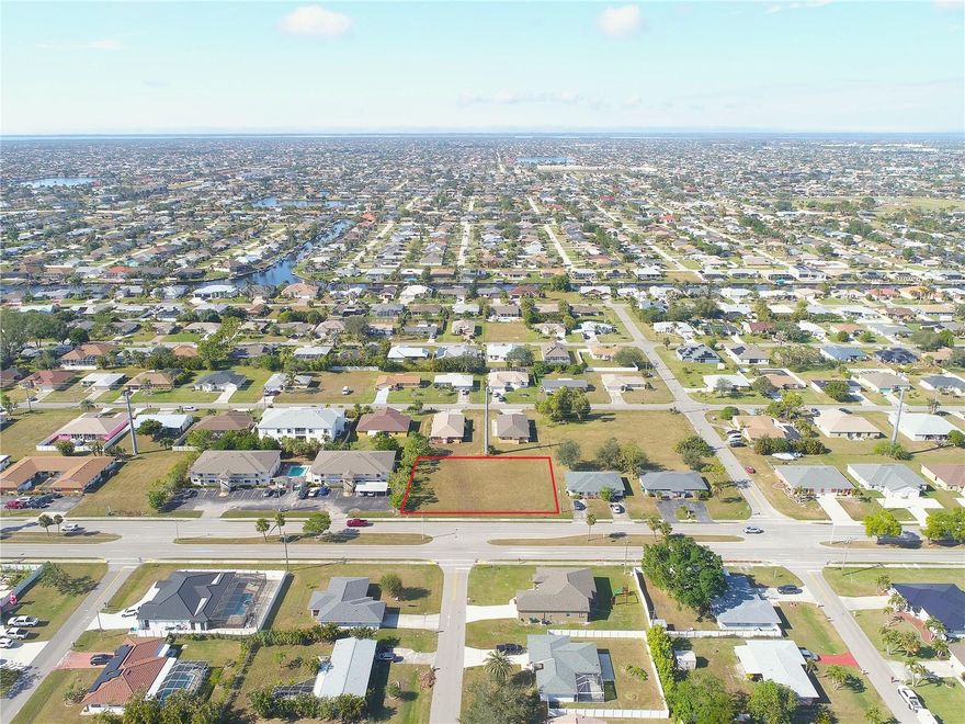 Huge price reduction! Build-ready 0.46-acre double lot in a prime South Cape Coral location on Santa Barbara Boulevard. Zoned RML, allowing single-family or multifamily development, with city water, sewer, and irrigation already installed. The parcel may be developed as a single site (for example, a six unit building) or split into two 0.23-acre lots, offering flexibility for a range of build strategies. Boundary survey available as is a recent environmental report indicating no protected species or environmental issues on site. Conveniently located near Cape Coral Parkway, shopping, dining, medical facilities, and major corridors, with strong surrounding residential development. AE flood zone. Buyer to verify zoning, density, and permitting requirements.