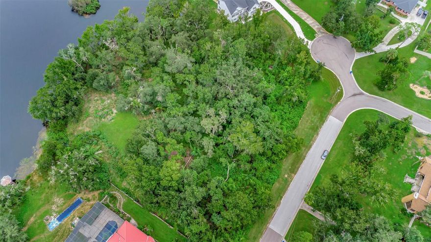 Located in the highly desirable Shadow Run community in Riverview, this large lot has privacy and character. Shadow Run is known for its unique custom-built homes, adding charm and architectural distinction throughout the neighborhood. This is one of the last remaining waterfront lots in the community, offering a partially cleared space. Private water front access to Lake Grady, as well as the benefit of NO CDD fees and a low HOA. Convenient central location you'll be just minutes from shopping, dining, top-rated schools, and major highways, offering an easy commute to Tampa, St. Pete, Sarasota, and Orlando. Don't miss this opportunity call today! Owner is also selling the neighboring lot. MLS #TB8420185. It can be negotiated to purchase the lots together. *Note *areas of wetlands* requires Buyer due diligence to ensure lot is suitable for intended use. There is an EPC approved survey available with the wetlands delineated. Approval and credits may be needed to build on the lot. This lot does require septic & well.