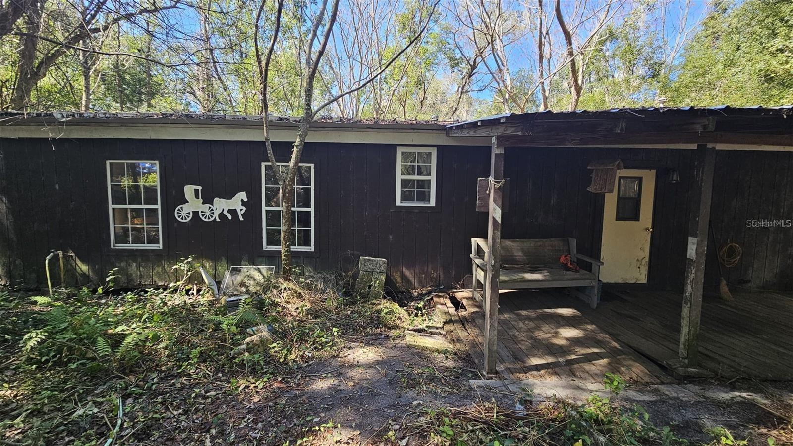Under contract-accepting backup offers. Great opportunity to own this 3 acre property with a double wide manufactured home surrounded by Oaks and a pond in the rear in the Majestic Oaks subdivision. Some TLC needed. Well and septic on the property. Whether you're looking to build or simply enjoy the beauty of the great outdoors, this property offers a unique opportunity to make it your own. Call for more information.