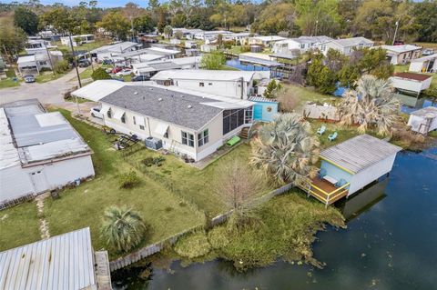 Photo of 26142 Rose Ln, Astatula, FL 34705 (MLS # O6386267)