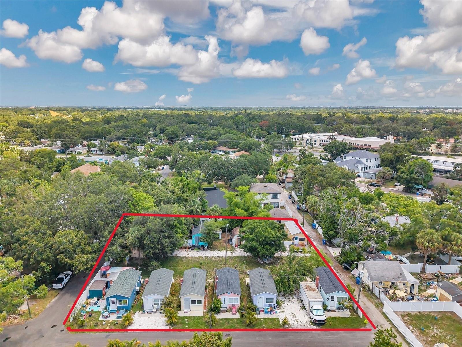 Prime Development Opportunity Located in the heart of the highly sought-after Magnolia Heights neighborhood, this oversized lot is zoned and ready for development, offering a rare and valuable opportunity for developers and investors. The property currently features 9 studio-style homes and multiple storage sheds, providing immediate rental income while you finalize your vision.
This expansive parcel presents the perfect canvas for building luxury single-family homes or modern townhomes in one of St. Petersburg’s most desirable areas. With easy access to major roads, you're just minutes from Downtown St. Pete, the 4th Street corridor, shopping, dining, and world-famous Gulf beaches.
Don’t miss this exceptional opportunity to capitalize on location, scale, and potential — properties like this are hard to find!
