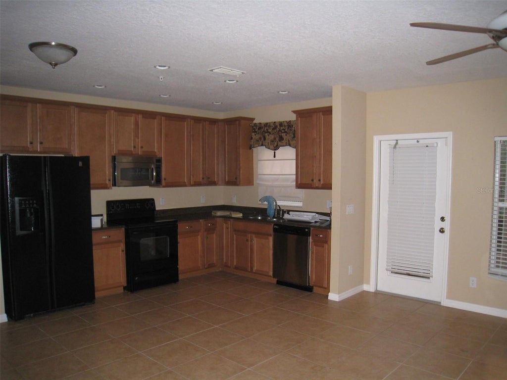 Photo of 9663 Biscotti Avenue, Orlando, FL 32829 (MLS # O6438116)