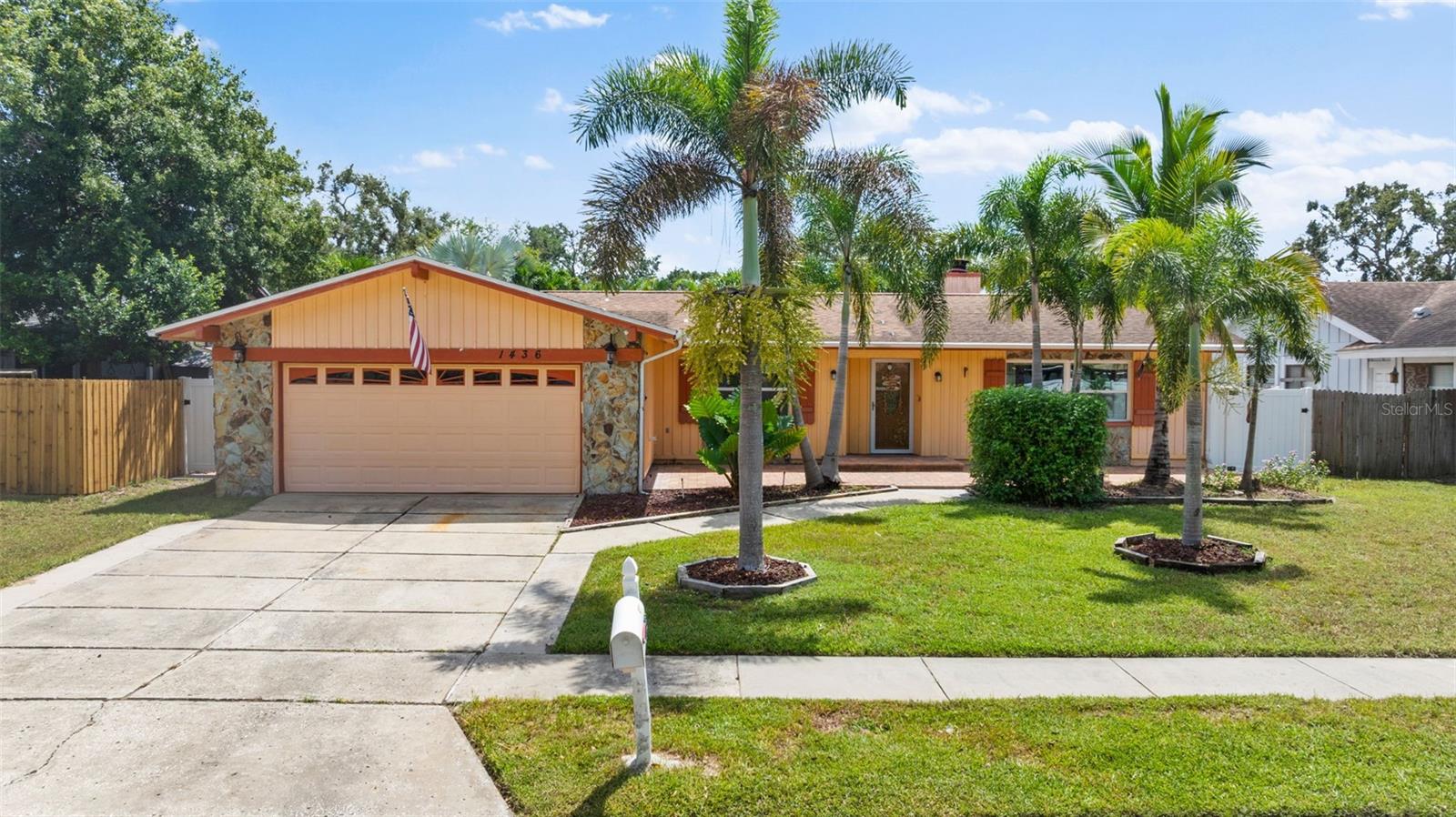 Beautifully designed 3BR/2BA home with spacious living areas. The welcoming front entrance with elegant pavers welcomes you and sets the tone for what’s inside. Step into an open-concept layout featuring a large living room with a cozy wood-burning fireplace and formal dining room, perfect for entertaining. The kitchen has granite countertops and abundant cabinetry. The large, separate pantry room with floor to ceiling cabinets offers plenty of storage. The split floor plan ensures privacy with a primary bedroom offering an ensuite bath for your own retreat. Enjoy year-round sunshine in the expansive Florida room featuring 3 sliders that overlooks the sparkling pool, tiki bar area, and private fenced yard. Additional highlights include thermopane windows, large shed, and access to top-rated schools. This home is minutes from the beautiful Honeymoon Island State Park with 4 miles of sandy beaches. Perfect blend of comfort, style, and Florida living.