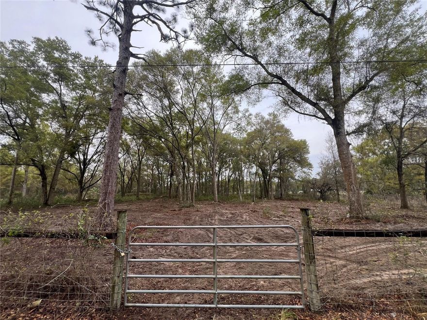 Vacant land conveniently located near shopping centers and a wide variety of local amenities. This versatile property offers an excellent opportunity to build your dream home or place a mobile home, providing flexibility to suit your lifestyle needs. Enjoy easy access to the Suncoast Parkway, making commuting and travel simple and convenient