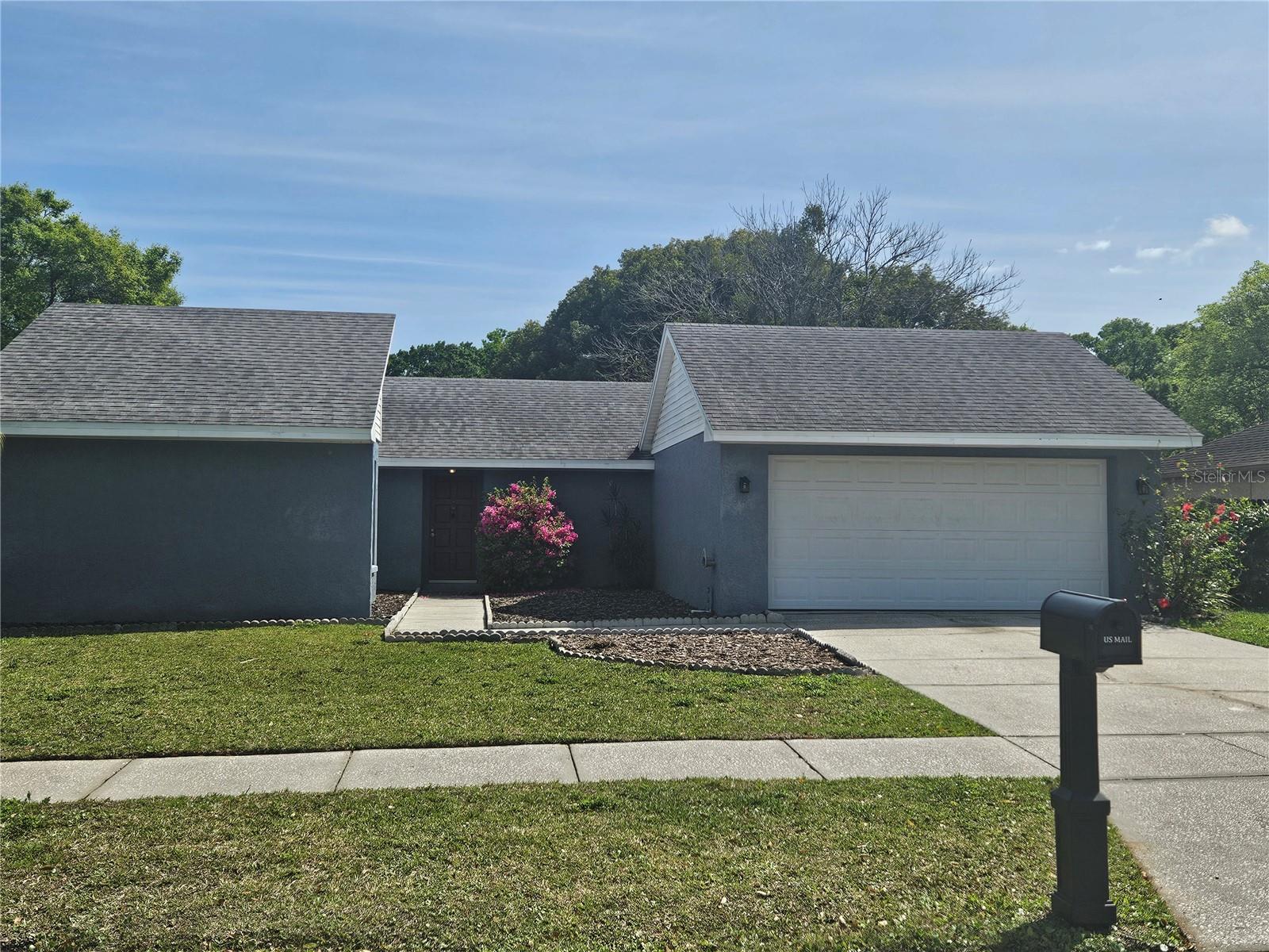 LOVELY LARGE YARD AND UPDATED HOME in sought-after Country Place HOA home of low association annual dues and great schools!! Located in Northeast Hillsborough County, this beautiful community has two well-maintained parks and with lots of lovey trees! And a great sense of community. The home has too many NEW features to mention but let's start with the stunning kitchen - brand new never used appliances!! Next up - new fence for the lovely large backyard. New paint and carpet with durable ceramic tiles throughout the main areas of the home. This home features a large garage with remote for lots of storage. This home has three bedrooms with a floorplan that seems larger than the square footage. Open lifted ceilings in the living and the view to the kitchen -BEAUTIFUL! Easy to show, ready to go!