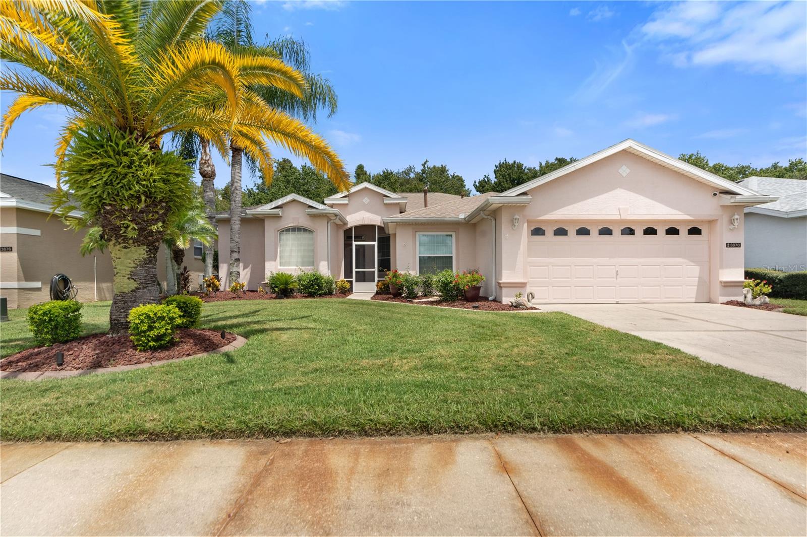 Welcome to this beautiful 3 bedroom PLUS an office, 2+ car garage SALT WATER pool home in the gated community of Carillon Lakes. This home screams pride of ownership from the curb. The manicured front lawn welcomes you in to the screened front entrance. The home boasts both a formal living room and a very large family room with a split bedroom floorplan. The bright master bedroom has an oversized en-suite bathroom. The bathroom has two walk-in closets, a dual sink vanity, jetted garden tub, walk-in shower, linen closet and private water closet. There are sliding doors that lead from the master to the pool deck. There are sliding doors from the living room, breakfast nook and family room that also leads out the the screened in pool. These sliders let in loads of natural light and offer amazing views of the wooded area behind the home. The kitchen has corian counters, wood cabinetry, small breakfast bar as well as the nook. Just off the kitchen is the spacious family room. The two guest bedrooms are both roomy and bright and share the second bathroom. The inside laundry leads to the oversized two car garage with an extra "bump" out perfect for storage or golf cart parking. Updates - All new irrigation system, New outdoor and POOL LED lighting that changes colors and has multiple modes.. New Pool pump and pool heater. New washer and dryer. New refrigerator and microwave. Roof and solar fans 2020, new windows 2019. This is a homeowner friendly HOA which includes Spectrum cable and wifi, grass maintenance (cut and edging included). Carillon Lakes offers residents a multitude of great amenities - a community pool/spa, fitness center, tennis courts, a recreation/reception hall, pickleball, a playground, billiard & card rooms, and even walking paths around the Lake! There is something for everyone in Carillon Lakes! Schedule your private tour today!