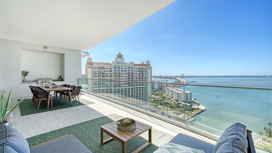 Sublime. Sophisticated. Sarasota’s Ritz-Carlton Residences. The most luxurious waterfront lifestyle coupled with an enticing downtown location.  It's waiting to exceed all your expecatations at the BEST PRICE POINT AVAILABLE AT 401 QUAY! Contemporary yet elegant, this 14th floor 3-bedroom, 3.5 bath residence was completed in 2021 and offers unparalleled amenities and service. Stunning views of Sarasota Bay, downtown and the Gulf of Mexico await as you enter your private elevator and custom foyer. You’ll instantly notice the spacious Emerson floorplan with soaring windows and ceilings – an architectural design that transitions entertaining and relaxing spaces effortlessly. The refined finishes exude quiet luxury – including Wolf and Sub-Zero appliances, modern cabinetry, quartz countertops and an impressive island complete with a luxe waterfall and custom lighting. Entertaining an intimate group with cocktails or a crowd with catering is simplified with a generous dining area, built-in bar, wine fridge and plating area. The living space holds the greatest allure – a haven to relax and gaze westward for stunning sunsets. Step outside your disappearing floor-to-ceiling glass sliders with a favorite beverage to enjoy magnificent Sarasota evenings – complete with grill area and a grande balcony. Your day begins in the owners retreat where morning coffee tastes a bit better on your private bayfront balcony with unobstructed views. Enjoy dual custom closets and a spa-worthy bath with expansive tiled shower with rainhead, custom lighted vanities, porcelain floors and walls, and separate water closet. Lavish accommodations await your guests with ensuite baths and noteworthy views to SRQ’s vibrant downtown and beyond. Thoughtful elevator placement means you’re just steps to two dedicated and secured parking spaces – along with climate-controlled storage and a service entrance. Luxe details include: large-format porcelain floors; 10 & 11 ft ceilings; custom lighting and closets throughout; tray ceilings; impact-rated windows and doors; automated shades and blinds; oversized laundry and storage. In true Ritz-Carlton style, enjoy the 24-hour concierge with valet service and world-class amenities – including a fitness center, 70-ft lap/fitness pool, resort pool with grilling area, club room for events, game room, lounge and meeting areas plus access to the adjacent hotel and spa. You’re just steps to the Bay – for waterfront trail walks, outdoor yoga or launching your kayak. Walk to the Van Wezel for the latest shows and concerts. Stroll across the street for the area’s best culinary offerings, theatre, opera, farmers market and marinas. An elegant and extraordinary lifestyle awaits!