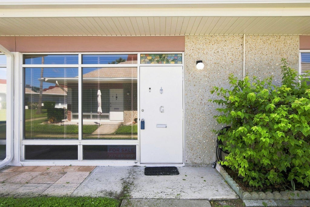 Photo of 4349 Tahitian Gardens Circle #G, Holiday, FL 34691 (MLS # TB8547070)