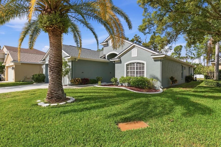 Welcome to this beautifully maintained pool home in the gated community of Key Vista, where residents enjoy a wide array of amenities, including a clubhouse, fitness center, tennis and pickleball courts, volleyball courts, a heated pool and spa, a playground, and numerous community events for all ages. As you enter the foyer, you’re greeted by high ceilings, an open floor plan, and abundant natural light. A spacious formal dining room is perfect for special occasions, while the kitchen offers casual dining and a breakfast bar ideal for entertaining. The living room flows seamlessly into a den/media room, which features newer luxury vinyl flooring and overlooks the pool. The kitchen, equipped with wood cabinets and granite countertops, provides both style and functionality, with two closet pantries and a nearby laundry room for added convenience. The split bedroom layout ensures owner privacy, placing the primary suite at the rear of the home with peaceful views of the pool. The en-suite bathroom includes a walk-in closet, large soaking tub, glass-enclosed shower, and dual-sink vanity. Two additional bedrooms share a full guest bath and offer vaulted ceilings and ceiling fans for comfort. Outside, a covered patio with ceiling fans provides a shaded space for relaxing or dining, leading to a screened pool area with ample room for seating and grilling. The solar-heated pool adds energy-efficient enjoyment, and the two-car garage offers generous space for vehicles and storage. Low monthly fees of $158 cover amenities, security, and basic cable/internet. Nearby, a 101-acre park offers nature trails, a boardwalk, an observation tower, fishing, and restrooms. This home is also conveniently located near the Tarpon Springs Sponge Docks, golf courses, marinas, restaurants, and shopping. Don’t miss the chance to own this stunning home in one of Holiday’s most desirable communities.