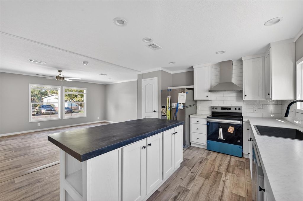 Photo of 1913 Woodcrest Drive, Ormond Beach, FL 32174 (MLS # O6368466)