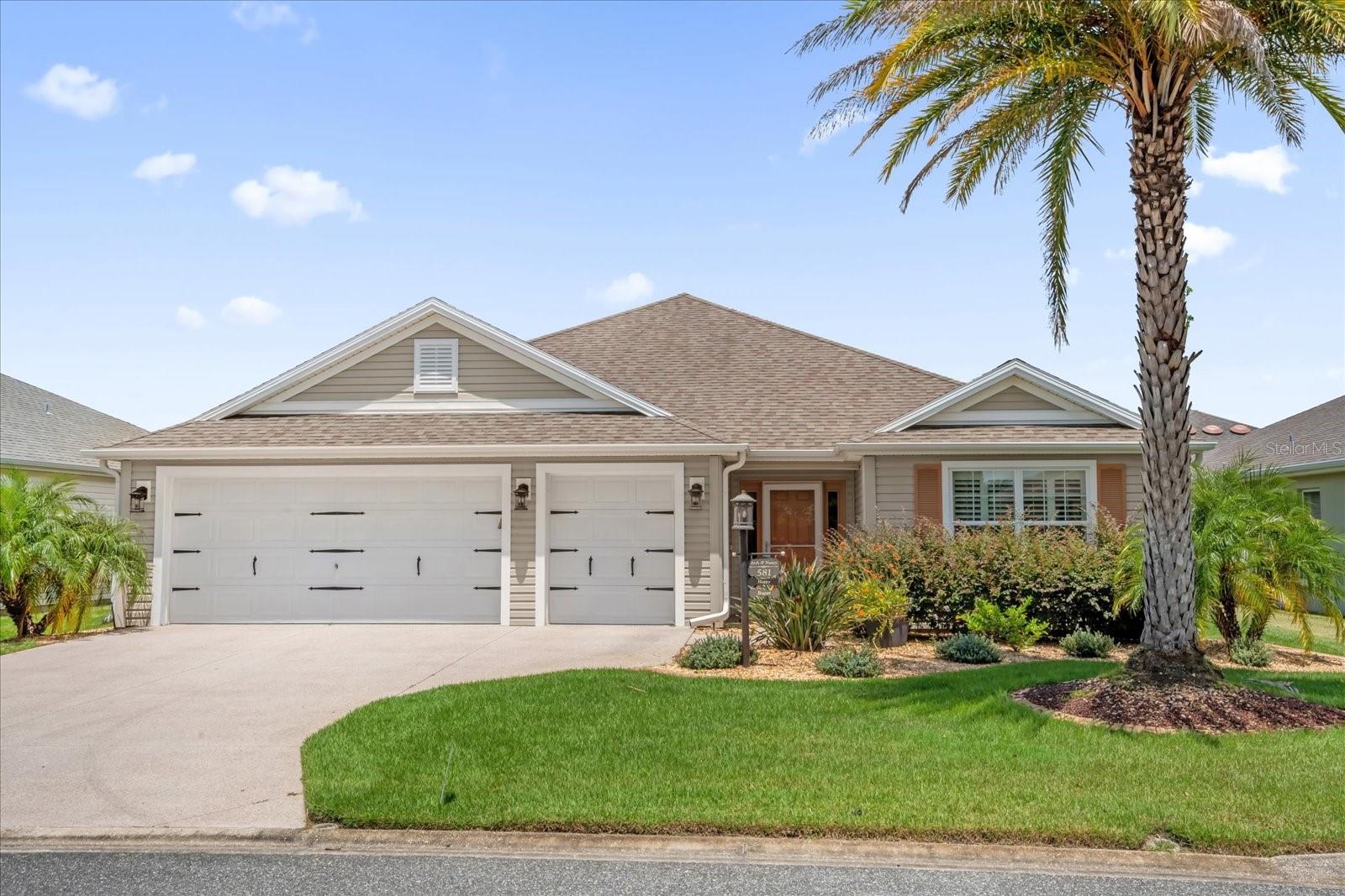 This beautifully maintained home in The Village of Sanibel offers a perfect blend of style and comfort. Luxury vinyl flooring flows throughout—no carpet in sight. The kitchen features granite countertops, stainless steel appliances including a French Door refrigerator and glass-smooth top range, and a solar tube for added natural light. The interior was professionally painted, and the home includes a brand-new air conditioner installed in August 2025. Plantation shutters add elegance, while knockdown ceilings and double-pane Low-E windows enhance comfort and efficiency. The primary suite boasts a tray ceiling, dual vanities, and a Roman shower. The laundry room features top-of-the-line front-loading washer and dryer. The spacious 2 car, plus golf cart garage provides ample room for vehicles and storage. The glass-enclosed lanai opens to a back patio with a decorative wrought iron railing, and privacy landscaping between the homes creates a secluded feel. The front yard showcases Florida-friendly landscaping with Curb-It borders and rock-filled beds for low maintenance. Located just minutes from Colony Plaza on CR 466A, with shopping, dining, and the Neighborhood Walmart, and conveniently close to the Sarasota Aqua Range on Morse Boulevard—a unique driving range where golf balls are hit into the water.