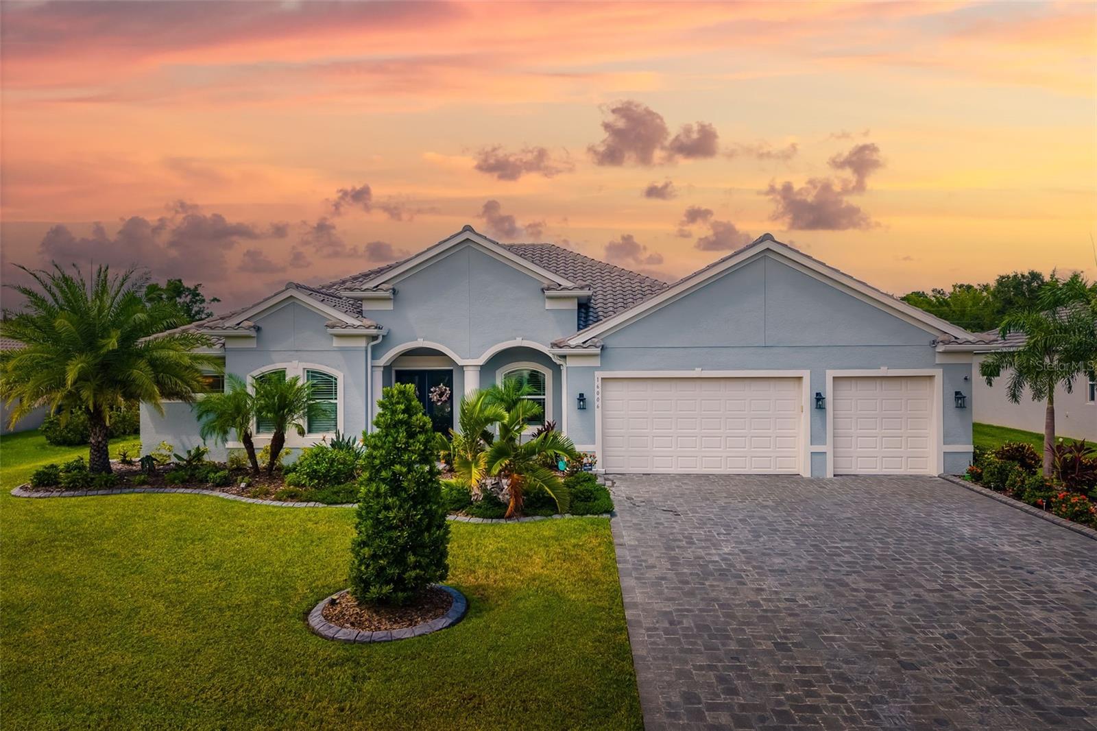 Nestled in the prestigious gated community of Reserve at Twin Rivers in Parrish, Florida, this distinguished residence at 16006 42nd Glen East stands as a paragon of modern elegance and refined living! Constructed in 2021, this exquisite single-family home spans an impressive 3,275 square feet, thoughtfully designed to harmonize luxury w/ functionality across its 4 BR/3 Full BA, Office, and Bonus Room! Set upon a generous 0.32-acre lot, the property exudes an aura of exclusivity, enhanced by its meticulous landscaping that is fully fenced, heated saltwater pool w/ enclosure, and serene location. Upon entering, one is greeted by an expansive open-concept w/ private office, where luxury vinyl tile and an abundance of natural light create an inviting ambiance. The gourmet kitchen is a culinary masterpiece, featuring an oversized quartz island, a chef-inspired induction cooktop, and under-cabinet LED lighting, and an expansive eating space that seamlessly overlooks the outdoor oasis. Adjacent, the living area is accentuated by a custom-built wall unit framing an elegant electric fireplace, complemented by crown molding and tray ceiling- evoking a sophisticated yet warm atmosphere ideal for both intimate gatherings and grand entertaining. The primary suite, a sanctuary of tranquility, spans the entire back wing of the home, offering private access to a screened lanai with pool views. Pristine!