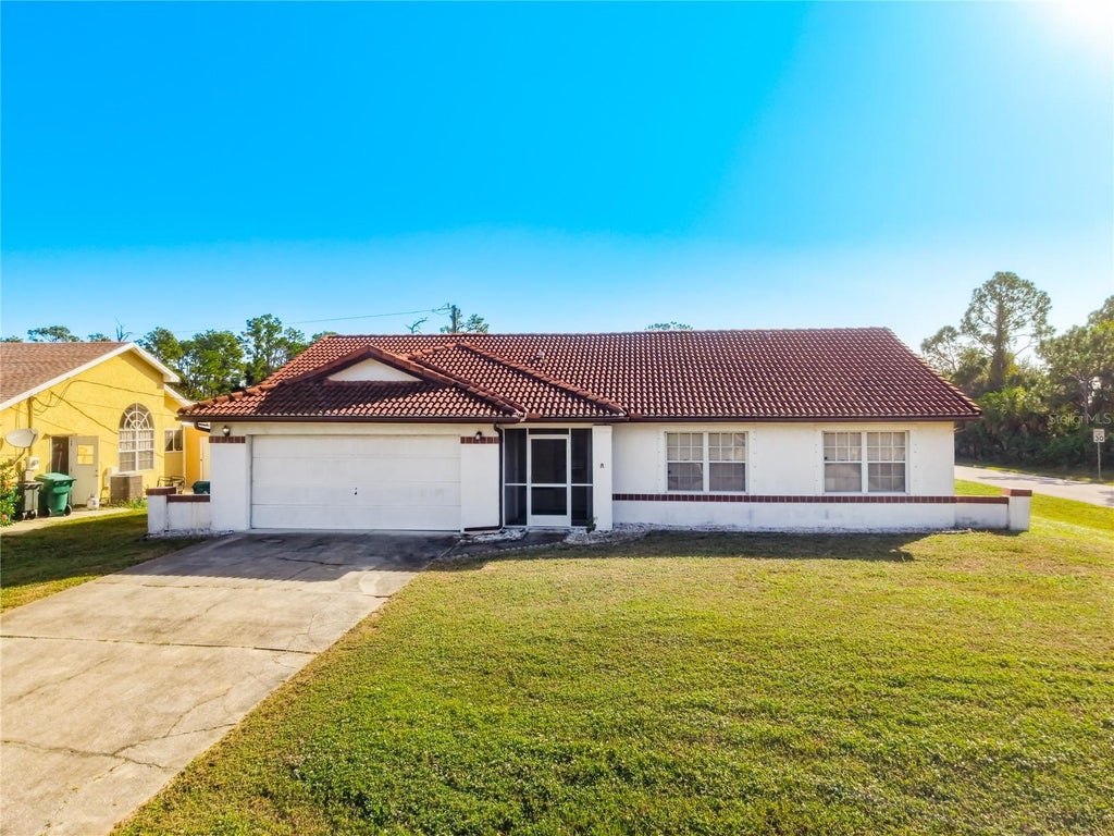 Photo of 3060 Collingswood Boulevard, Port Charlotte, FL 33948 (MLS # TB8563100)