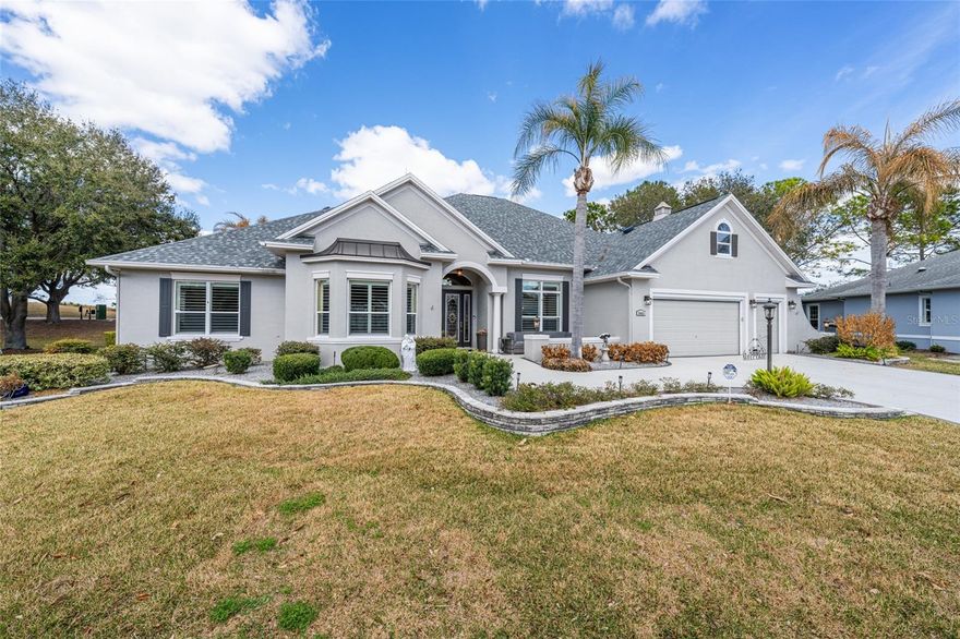 BOND PAID! Stunning Sanibel Premier with spectacular pool, spa, and summer kitchen overlooking the Championship Nancy Lopez Golf Course in the highly sought-after Village of Royal Oak at Springdale!
Tucked away on a quiet cul-de-sac, this exceptional home offers outstanding curb appeal with a stamped driveway and walkway, upgraded landscaping, and elegant leaded glass front door with sidelights.
Inside, you’ll find beautiful new vinyl planking flowing through the foyer, living and dining rooms, kitchen, laundry, hallways, and baths, with vinyl planking flooring in the guest bedrooms, and engineered wood flooring in the primary bedroom
The spacious open kitchen is truly a showpiece featuring:
• White bay stair-step cabinetry with crown molding
• Granite countertops
• New stainless appliances
• Wall oven and gas cooktop
• Pot drawers and pull-out pantry shelving
• Separate ice maker
• Under- and over-cabinet lighting
• Center island with pendant lighting
The casual dining area offers charming custom window seats and peaceful views of the pool.
The living room opens seamlessly with stack-back sliding glass doors to your private outdoor oasis — a gorgeous heated pool and spa with stunning water feature, resurfaced in 2019, along with newer LED lighting, pool pump, and gas heater. The fully equipped summer kitchen and expansive birdcage enclosure make this the perfect space for entertaining while enjoying sweeping golf course views. Just outside the enclosure, a paved side patio with privacy hedge creates an additional serene retreat.
The oversized primary suite features a tray ceiling, wall-mounted TV, and a luxurious en-suite bath with dual sinks, garden tub, Roman shower, private water closet, and a huge walk-in closet.
Guest accommodations are equally impressive:
• Front guest room with plantation shutters (featured across the front of the home)
• Expanded second guest room with sliding glass doors to the pool and a queen-size Murphy bed
• Guest bath with solar tube, tile-surround tub/shower, and new walk in shower.
The laundry room includes built-in sink, additional cabinetry, newer washer and dryer, and open shelving.
Car enthusiasts and hobbyists will appreciate the expanded 2-car garage plus golf cart garage with epoxy flooring, storage closet, and incredible overhead storage accessed by a 250-lb capacity electric freight elevator and electric attic stairs.
Additional premium features include:
• Surround sound in living area and lanai
• HVAC with surge protection
• Whole-house water filtration system and water softener. whole house Generac Generator.
• Three solar attic fans
• Lightning protection system
• Hidden dog fence surrounding the property
This is truly an exceptional, meticulously upgraded home in one of The Villages’ most desirable golf-front locations.
And yes… THE BOND IS PAID! NEW ROOF 2022, 2 NEW HVAC SYSTEMS 2025 AED is here and shared by the neighbors in the cul de sac