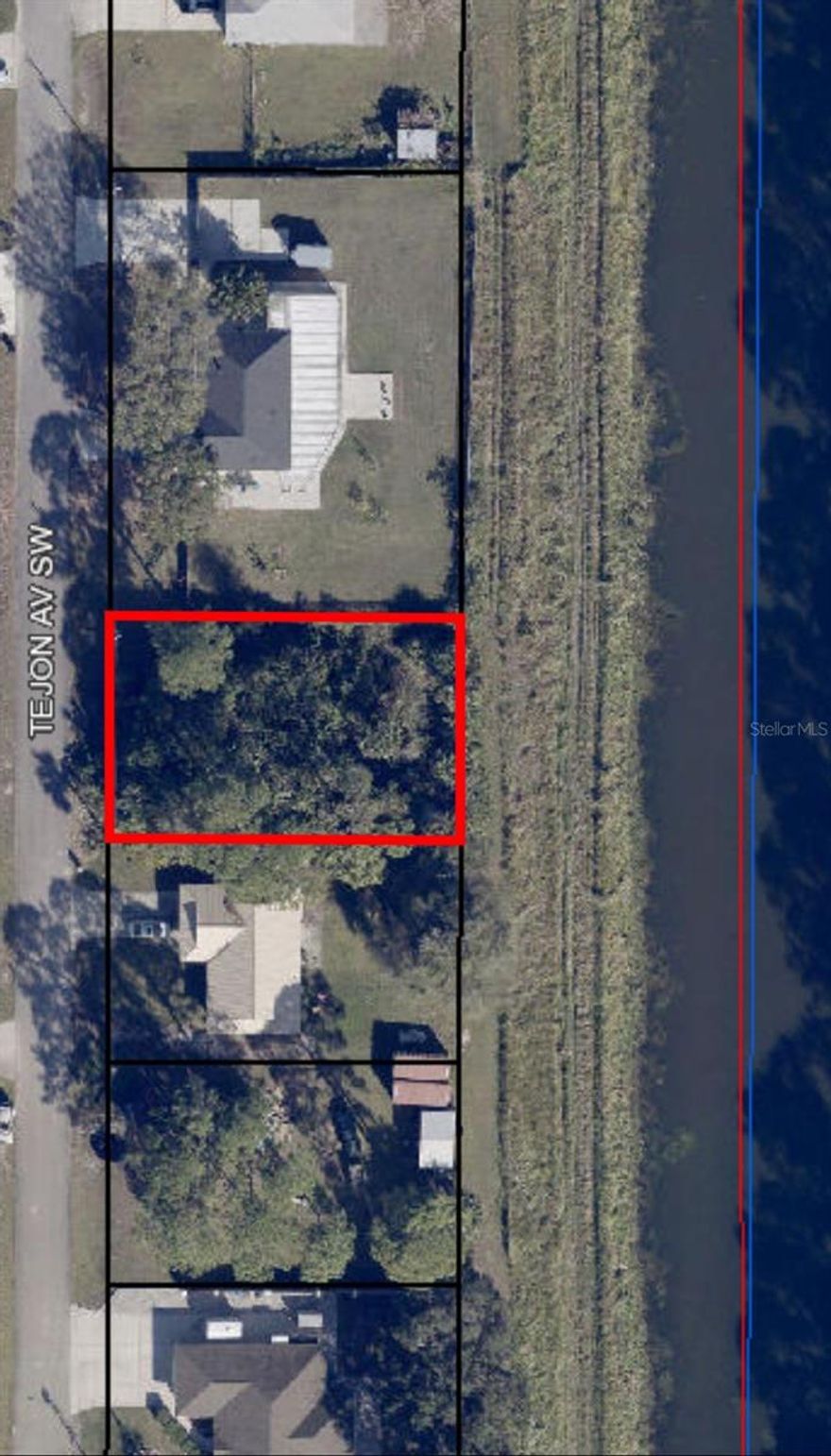 Prime vacant lot that backs to a wide canal, offering increased privacy. **Conveniently located near shopping, restaurants, major roadways, and all daily needs. **The lot is in its natural state, with paved roads providing easy access. **Well water/septic utilities. **Don't miss out on this incredible opportunity to build your ideal retreat!