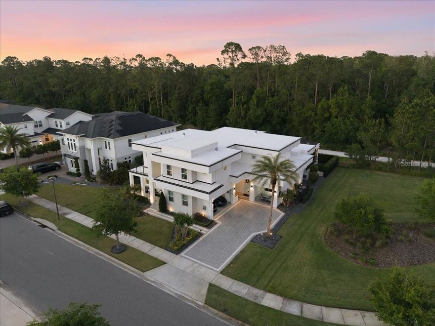 WELCOME HOME TO THE PRESERVE AT LAUREATE PARK! We often hear that a home is "one of a kind" or “special”, but it is both rare and refreshing when a home actually delivers…and this home truly delivers. This Stunning, Sophisticated, and Immaculate 4 Bedroom, 4.5 Bath, 4150 htd sqft Masterpiece, is nestled in one of Lake Nona’s most vibrant and exclusive gated communities. The Owners have meticulously upgraded and re-imagined this better-than-new, awe-inspiring Builder’s Model Home! This home truly is One of One! Every detail has been thoughtfully and impeccably finished. Recent upgrades include: a fully renovated modern, Primary Bath, partial/full guest and accessory bath renovations, new porcelain-tile flooring throughout the main level, designer lighting throughout, new stacked stone accent wall in family room, new weather-resistant outdoor lanai TV, newer landscaping, new soft-touch outdoor lighting, new sprinkler system, as well as fresh interior and exterior paint throughout. For the car enthusiast, the 3 Car garage has been converted to a Climate Controlled auto spa with newly-coated epoxy flooring.  A custom shell-shake, expanded tile driveway has been added to host all your toys! The recently upgraded whole-house generator provides you with year-round peace of mind, no matter what the weather! You have nothing left to do to this fully-enhanced home…all the work has been done for you! Its light, bright, airy, and open concept features a formal living room, formal dining room, a state-of-the-art media room/flex-space, a private first-floor office, a spacious loft, and a seamless flow between the indoors and outdoors. The modern Kitchen is a Chef’s Dream, featuring all new Stainless-Steel Thermador appliances, a new Scotsman ice maker, tons of countertop space, and an over-sized eat-in breakfast island. The cozy breakfast nook is full of natural sunlight and overlooks the entertaining and pool areas. The heart of the home was designed around the amazing, extremely private outdoor entertaining area and oversized pool…perfect for the Florida fun-in-the-sun lifestyle! The gorgeous screen-enclosed Pool and waterfall feature creates an amazing Zen-quality atmosphere that will make you never want to leave! The Covered Lanai boasts a fully equipped Summer Kitchen, with newer outdoor grill. The oversized lot boasts no rear neighbors (conservation views) and no right-side neighbors (park setting views), with some of the most peaceful and serene views in all of Laureate Park. Not to mention… your very own mesmerizing fire and light show you get after dark each night! Laureate Park is not just a neighborhood—it is the epitome of what living the Florida lifestyle is all about. You will enjoy Top-Rated Schools, a community-centric restaurant and market (Canvas), and Community Amenities that are Second-to-None! From the resort-style Aquatic Center, LP Fit gym, waterpark, dog and scenic parks, to over 44 miles of walking and biking trails, there is something for everyone in this neighborhood! You are merely minutes to the VA Hospital, Nemours, the US Tennis Association National Campus, top restaurants, shopping, Boxy Park, all in the Lake Nona Town Center. Enjoy convenient access to major highways, making for a short drive to the Orlando International Airport, Walt Disney World, Universal Studios, SeaWorld, and Downtown Orlando. You are just an hour’s drive from some of Florida’s Finest Beaches! This home is an absolute DO-NOT-MISS-MUST-SEE!