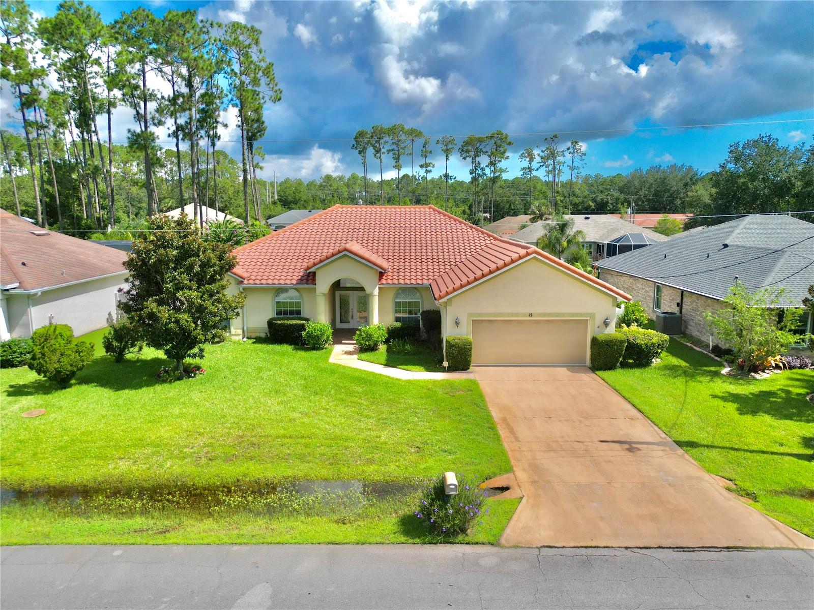 Welcome to your new home in beautiful Palm Coast, Florida! This stunning custom-built residence offers the perfect blend of luxury, comfort, and convenience. Nestled in a peaceful neighborhood, this spacious home is just minutes from pristine Atlantic beaches, making it easy to enjoy sun-soaked days and coastal breezes year-round. Designed with both style and function in mind, this home features high-end finishes, a modern open floor plan, and plenty of natural light throughout. The gourmet kitchen is complete with premium appliances & custom cabinetry. Located just moments from top-rated schools, shopping centers, and local restaurants, you’ll have everything you need at your fingertips. Enjoy easy access to parks, golf courses, walking trails, and year-round entertainment that make Palm Coast one of Florida’s most desirable communities. Whether you're looking to relax at home or explore the vibrant local scene, this property truly offers the best of Florida living. Don’t miss your chance to own this exceptional custom home—schedule your private showing today! Built by top-rated Skyway Builders. Large open floorplan with great room & living rooms and 10' ceilings. Screened lanai with home surrounded by 6' white vinyl privacy fence. Irrigation system on well. HVAC 2022.