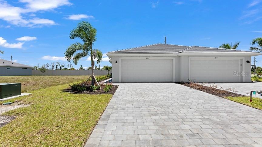 THIS HOME IS READY FOR YOU NOW!! Palm Lake at Coco Bay is a gated master-planned community with collections of new single-family homes for sale, coming soon to Englewood, FL. See what life at Palm Lake at Coco Bay has to offer Surrounded by beautiful streetscapes, this masterplan features an onsite swimming pool, a clubhouse, fitness center and playground. This attached single-story home delivers a cohesive design fit for modern living. Socialize on the stylish lanai or hideaway in the den, flexible as a study or media room. A front bedroom and bathroom create privacy for the owner’s suite with walk-in closet, which enjoys a back corner location. Prices and features may vary and are subject to change. Photos are for illustrative purposes only.