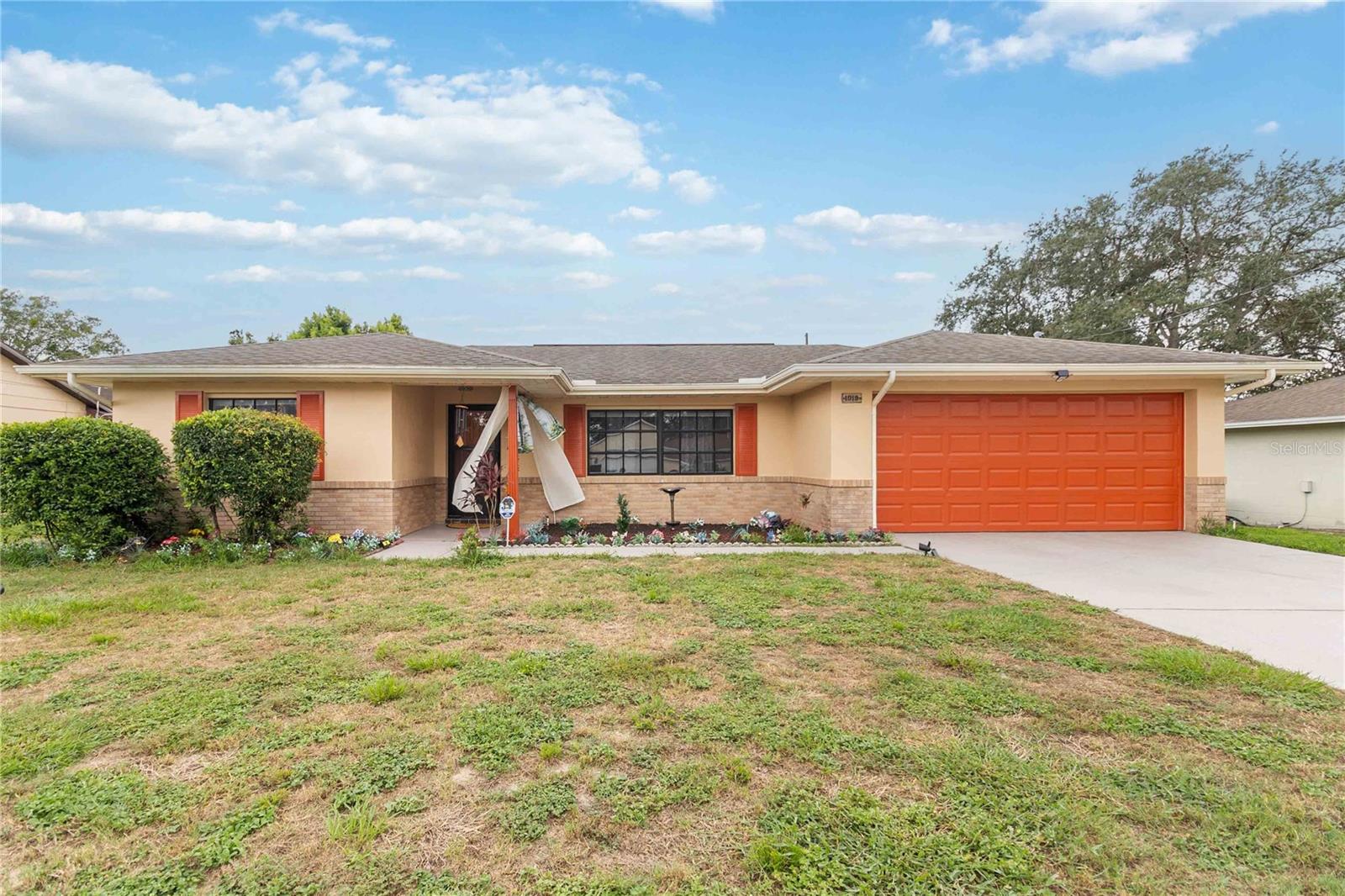 Welcome to this inviting 2-bedroom, 2-bathroom home in Deltona Lakes, offering 1,156 square feet of comfortable living space on just under a quarter-acre lot. With a two-car garage and thoughtful updates, this property combines convenience with charm. Step inside to find brand-new wood flooring throughout the main living areas, creating a warm and cohesive feel. The living room flows seamlessly into the kitchen, which provides plenty of space for cooking and gathering. A sliding glass door opens to the screened-in lanai, perfect for enjoying the outdoors while overlooking the spacious backyard. Both bedrooms feature plush carpeting, adding comfort and a cozy touch. Additional highlights include an updated water heater and the generous lot size, offering room for outdoor activities, gardening, or simply relaxing in your private backyard setting. The property also comes with preventative termite treatment through Massey for both subterranean and drywood termites, including attic spray, bait traps around the home, and a current, transferrable bond for peace of mind. Located in a well-established community, this home is close to shopping, dining, and everyday conveniences, with quick access to I-4 for an easy commute to surrounding areas. Whether you’re looking to settle into a first home, downsize, or invest, this property is a wonderful opportunity in the heart of Deltona. Mortgage savings may be available for buyers of this listing.