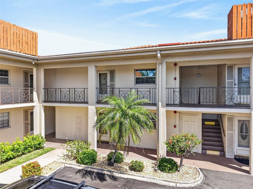 Imperial Cove is the kind of 55+ community that earns loyalty. Residents walk the lighted waterfront path along Tampa Bay at sunrise, meet friends for billiards or cards in the clubhouse, and organize their weeks around the social calendar rather than the to-do list. This updated second-floor residence fits right into that rhythm.
Inside, the home has been refreshed throughout. The kitchen has new shaker cabinetry, marble-look granite counters, and contemporary lighting, opening into a combined living and dining space that flows easily whether you're hosting a few neighbors or settling in for a quiet evening. Porcelain tile runs through the home, and fresh paint keeps everything feeling bright and cohesive.
The bedroom suite is positioned at the back of the unit, with a walk-in closet plus a second closet for genuine storage. The en-suite bath has been fully redone with a tiled walk-in shower, granite counters, and modern fixtures. A sunroom off the living room and bedroom pulls in soft light and looks out onto the grounds, making it a natural spot for morning coffee or an afternoon book. A dedicated downstairs storage room is included.
Imperial Cove sits directly on Tampa Bay, with an Olympic-sized waterfront pool, an impressive clubhouse anchoring two fitness rooms, a sauna, billiards, game rooms, and a ballroom for community events. Outside, residents enjoy community grills, two fishing piers, and the lighted waterfront walkway. The monthly fee covers exterior maintenance, insurance, grounds, pool, recreational facilities, security, trash, water, and cable. Flood zone X means no flood insurance required, and the community came through recent storm seasons unaffected.
The location puts you minutes from Clearwater Mall, Costco, and the US-19 corridor for daily errands, with Tampa International Airport and the Gulf beaches both a short drive.