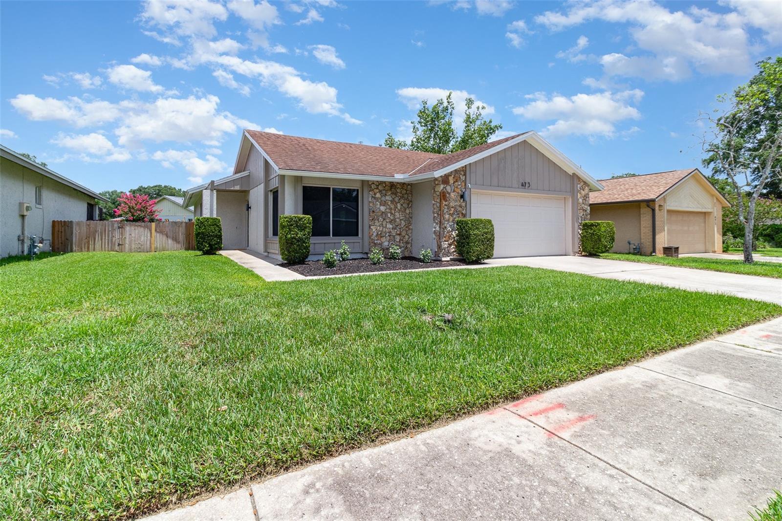 HERE YOU GO! A great opportunity to own a beautiful MOVE-IN READY home in the highly desirable community of RIVER RUN! NO HOA yet this tucked away community shows pride of ownership! Located in the heart of Altamonte Springs, this rare gem is good-to-go with upgrades galore including kitchen, bathrooms, flooring and fresh neutral color paint inside and out. The HVAC is newer (2023), replumbed in (2018), upgraded electrical panel box (2012). You will be impressed with the cleanliness and special attention paid to the attractive, contemporary upgrades. Whether you are a first-time homebuyer or downsizer you will feel right at home. As you step inside, the VAULTED CEILINGS enhance the size and comfort of an open, light floor plan. The dining area offers a seamless pass-through to the kitchen and peaceful backyard views through the sliding doors to the patio. The well-sized kitchen features eat-in space, stainless steel appliances, built-in microwave, fixture upgrades and closet pantry. The primary bedroom offers an en-suite bathroom, walk-in closet and slider door access to backyard patio which could be easily converted to a covered/screened patio. The second bedroom has a built-in bookcase to perfectly complement your home office needs. TONS OF STORAGE SPACE throughout! The spacious 2-CAR GARAGE provides ample parking and cabinetry for extra storage. The private, FENCED BACKYARD is the perfect size for those desiring the outdoor living experience yet needing low yard maintenance. There is still plenty of room to create your own outdoor Eden with a busy bird feeder or a butterfly garden. The security of the fenced backyard comes in handy with your fur babies! Conveniently located near A-Rated Seminole County Schools, shopping, entertainment, dining, I-4 access and two international airports. River Run residents have direct access to Seminole Wekiva Trail which offers 14 miles of walking, jogging, biking and hiking. Hurry in!