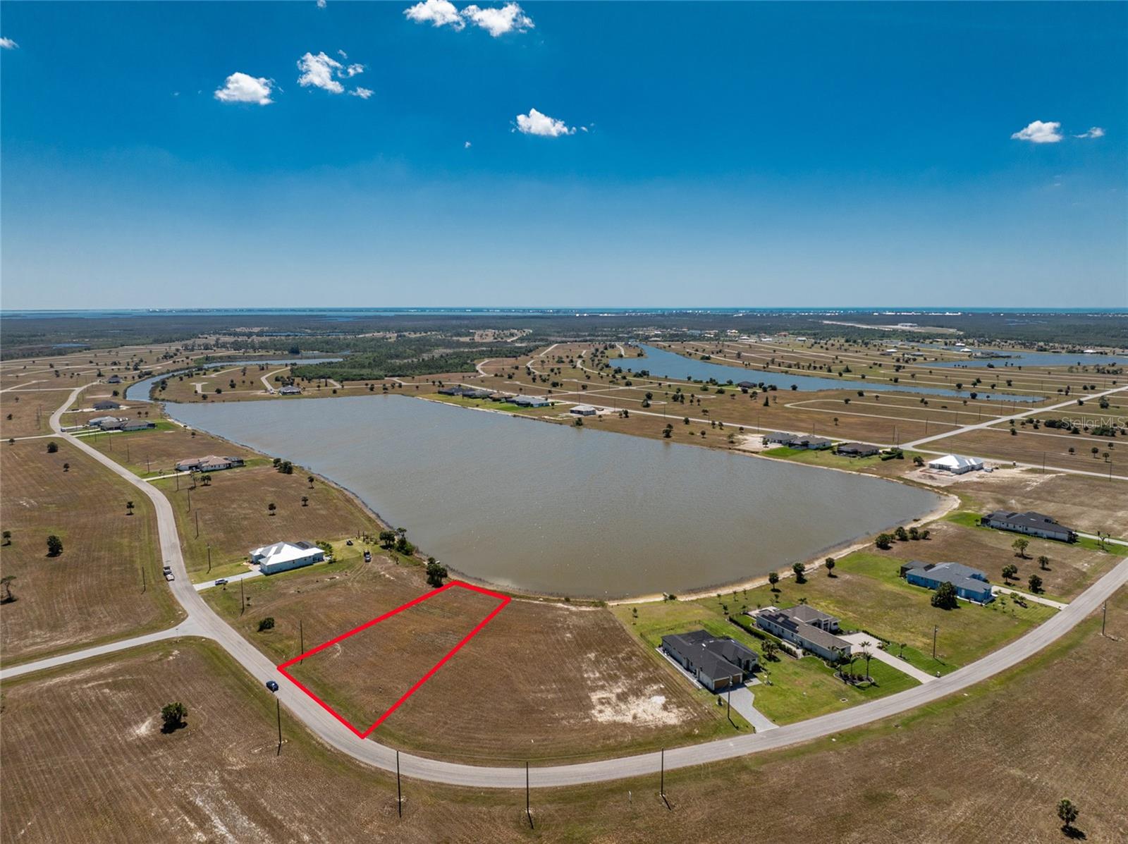 EXCEPTIONAL LAKEFRONT HOMESITE WITH BREATHTAKING VIEWS! Discover the perfect setting for your dream home on this spacious lakefront lot in Rotonda Meadows. With prime western exposure, you’ll enjoy vibrant sunsets each evening. Situated in this peaceful, well-maintained deed restricted community, this lot is surrounded by championship golf courses. The community features paved roads, public water and sewer, and low HOA fees. This is your opportunity to build a custom home in a desirable location, with plenty of space to create your ideal retreat. Enjoy easy access to Boca Grande and Englewood’s pristine beaches, boutique shopping, tiki bars, boat ramps, kayak launches, and world-class fishing, along with the many recreational amenities Rotonda West has to offer, including tennis, pickleball, scenic trails, and beautiful lakes. Don’t miss this rare chance to own a slice of paradise, schedule your showing today!