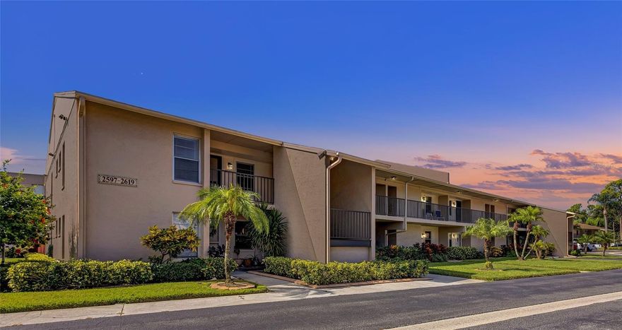 Welcome to Pinewood Village, a hidden gem in the heart of Sarasota. This spacious 2-bedroom, 2-bath condo is quietly located within the community and situated in Flood Zone X, meaning no flood insurance is required. The split floor plan is filled with natural light and features fresh interior paint, new carpeting, and ceramic tile flooring. An enclosed lanai with sliding glass and new screen doors provides a clean, comfortable extension of the living space while helping keep the unit quiet and protected from the elements. The kitchen offers generous cabinetry and counter space and opens to the dining and living areas, ideal for entertaining or relaxing at home. The primary suite includes a walk-in closet and en-suite bath, while the guest bedroom and bath provide flexibility. An oversized laundry room with a full-size washer and dryer adds valuable storage and convenience, a feature not found in all units. Another rare highlight is the assigned carport, with limited availability in the community, along with a reserved guest parking space. Community amenities include a resort-style pool, shuffleboard courts, fitness center, game room, sauna, and clubhouse with full kitchen. The monthly condo fee includes water, sewer, trash, exterior building and roof maintenance, grounds and landscaping, community amenities, and building insurance, offering a truly low-maintenance lifestyle. Ideally located just minutes from Siesta Key Beach, Downtown Sarasota, shopping, dining, and cultural attractions. All room measurements are approximate and should be independently verified by the buyer.