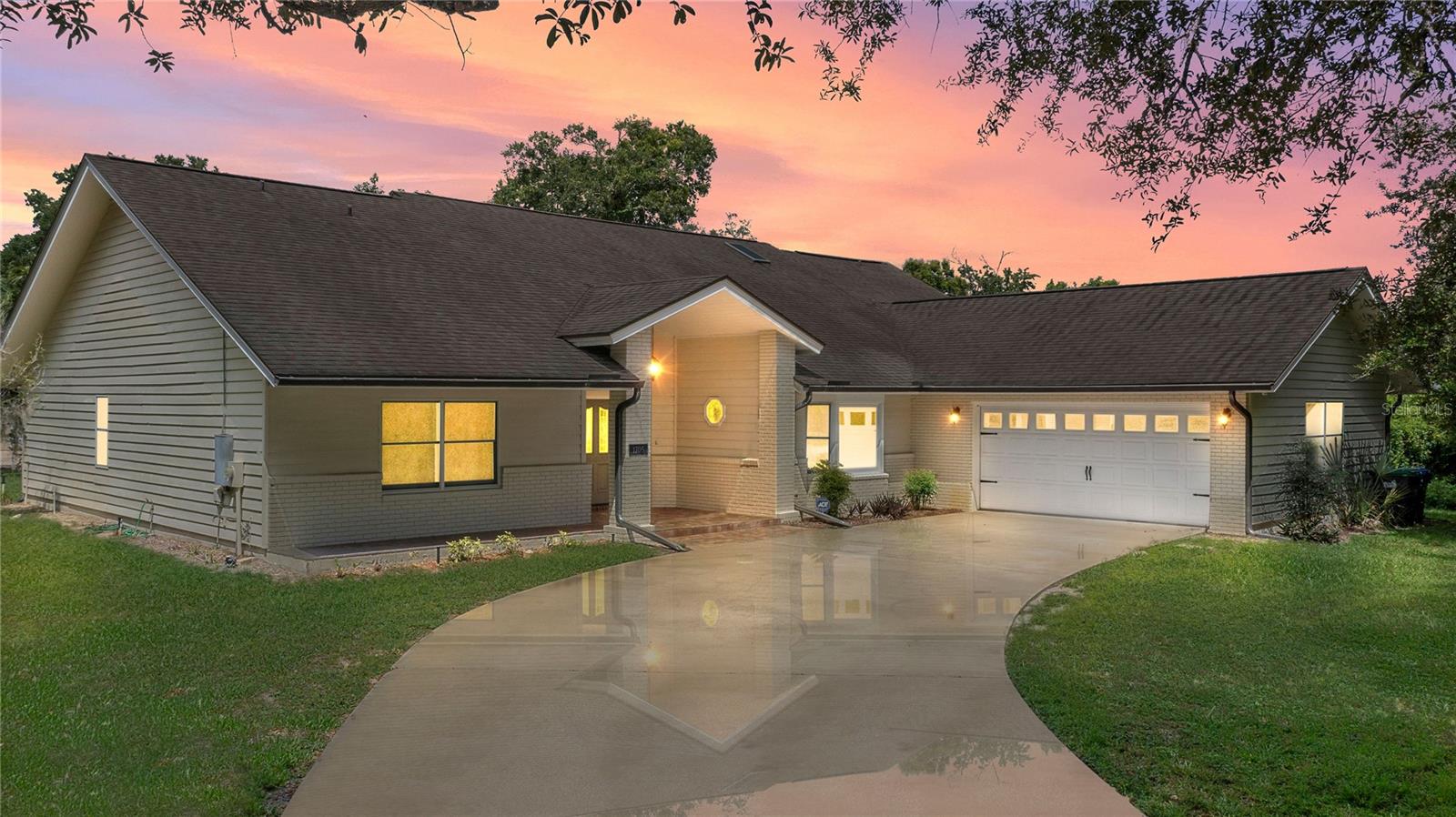 Charming 3 bed/3 bath home in Apopka’s Greenacres Estates community! This home features wood trim and doors that adds to the charm, sits on a large, 0.50 acre lot on a cul-de-sac, has an open floor plan, oversized 2 car garage, vaulted ceilings and NO HOA! This home features laminate flooring throughout the living areas with ceramic tile in the bathrooms – no carpet! When you walk in, the foyer will welcome you inside with a sunken living room featuring vaulted ceilings and skylights. The office will be on your left with glass French doors for privacy and has a closet so it can be used as a bedroom, if needed. The formal dining room is on the right, on your way to the kitchen that features newer stainless steel appliances with a wi-fi enabled fridge, wood cabinets with hardware, corian counters, a closet pantry, breakfast bar and dinette with a window overlooking the backyard. The living room features a wood burning, brick fireplace, two French doors on either side of the fireplace lead to the covered patio. What a great space to enjoy your morning coffee or unwind at the end of a long day! The owner’s suite is off the living room, has lots of windows that let in a lot of natural light. The en-suite bath features a two sink vanity, wood cabinets, a ceramic tiled walk-in shower, separate garden tub and water closet. The guest bedrooms are on the other side of the home for privacy. Each bedroom has its own bathroom for convenience. One guest bath has a taller toilet. The laundry room leads to the oversized 2-car garage that is wired for an exterior generator. This home has been lovingly maintained. Additional updates include newer kitchen appliances and remote fans. Centrally located to major roads and highways, yet you can experience quiet country living with great shopping and dining close by in Altamonte Springs. Make this home yours today!