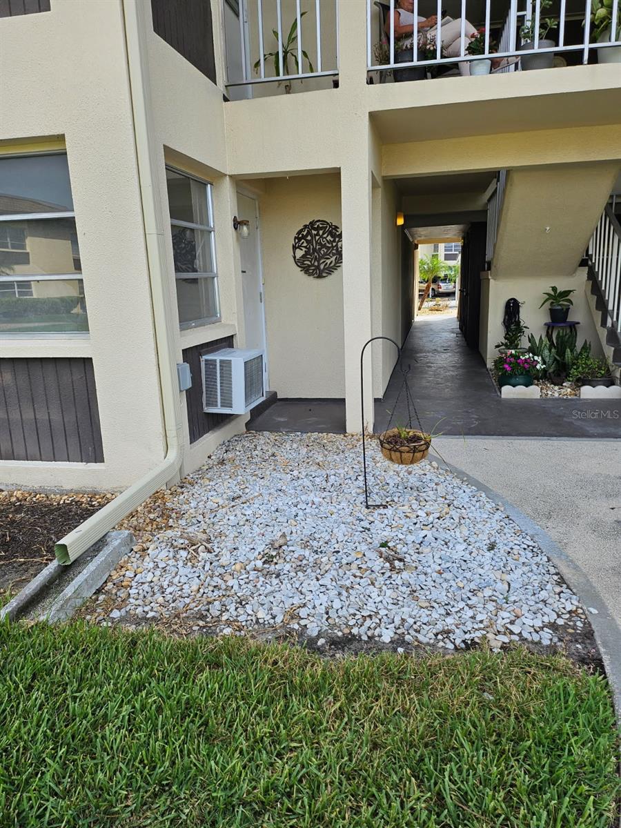 This condo was flooded by Helene and has had the walls taken out and replaced, needs to be finished, overlooks the garden area, kitchen has white cabinets and microwave still in place and may be able to match upper cabinets. Easy to show, has two full baths that need redone, make this yours with your own taste redoing it. Two pools in the community, close to the private Gulf harbors beach that you can join for $200 a year.