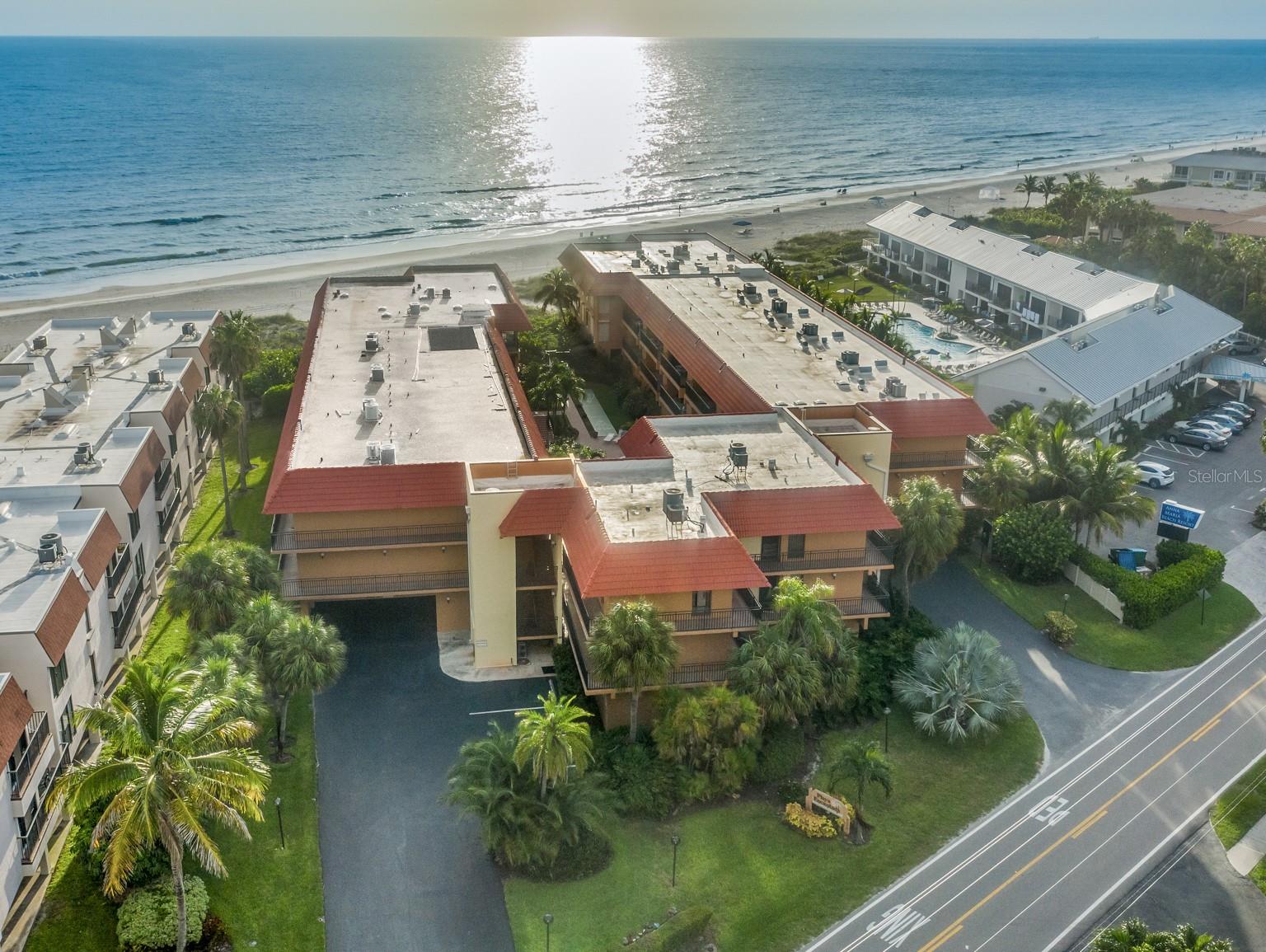 Living in a post card just became a reality! This airy coastal 2 bedroom 2 bathroom updated condo located on world famous Anna Maria Island with partial views of the Gulf of Mexico is a slice of paradise just waiting for you. Rarely units come for sale on the water in this community of only 38 units. Enjoy breathtaking sunsets over the water from your private lanai that overlooks the tropical heated pool/hot tub and courtyard. With ceramic tile flooring throughout, 2 skylights, full sized washer and dryer, underground parking plus storage, and an updated kitchen, this condo is move-in ready. The lanai has two entries from both the living room and the master bedroom, giving you easy access to the spectacular views that Anna Maria Island is famous for. Newer air conditioner with a transferable warranty. Now let's talk about the fabulous resort-style amenities. Playa Encantada is the total package with the white sands of the Gulf of Mexico at your fingertips, heated pool, tennis courts, shuffleboard, an elevator, and on-site management. This property is easy to rent and currently has a good list of past renters where you can live part time and rent the rest of the year. Very close to Tampa, St. Pete, and Sarasota makes this waterfront condo super easy to enjoy all the time. With all of this, you'll be telling the truth when you say “I live where you vacation”.