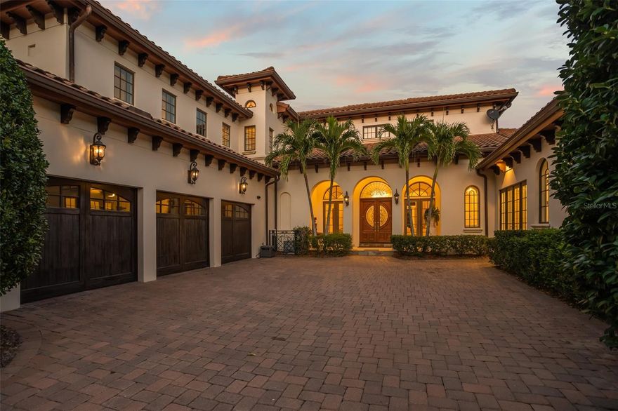 Located within the Garden Villas enclave of Isleworth Golf & Country Club, this spacious estate epitomizes luxury living. With an impressive 5,741 square feet of meticulously designed living space, this villa offers an exquisite blend of elegance and comfort, coupled with a host of exceptional features and amenities. The property encompasses four generously appointed ensuite bedrooms, ensuring residents and guests enjoy the utmost convenience and privacy. A designated office space caters to professionals working from home. The spacious chef’s kitchen is equipped with high-end Viking, Wolf, and Subzero appliances and offers plenty of storage space that is complemented by a butler’s pantry and an adjacent bar.    For those seeking to relish the Florida sunshine and the picturesque outdoors, the private pool and spa, along with a well-appointed summer kitchen and spacious lanai, create the perfect setting for outside entertaining. In addition, maintaining a healthy lifestyle is easy with a dedicated gym, providing the convenience of exercising right within the comforts of home. In essence, this Garden Villa exemplifies the pinnacle of luxury living by seamlessly combining a spacious layout with top-notch custom-designed features. Whether you seek solace in the gardens, a refreshing dip in the pool, or a productive work environment in your office, this property provides an unparalleled lifestyle of true distinction.