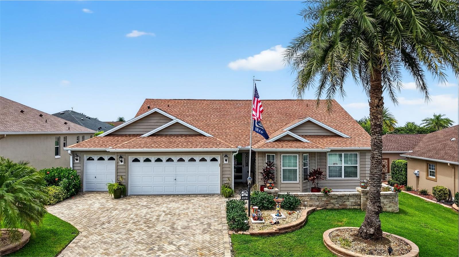 Welcome Home to the Lovely Ponderosa Pine in The Village of Bonita, just minutes to Lake Sumter Landing Town Square! This 4 bedroom, 2 bath home has several updates and upgrades starting with the gorgeous PAVER front patio and driveway installed in 2021 and updated LANDSCAPING completed this year as well as a NEW ROOF this month (August)!! Come inside and enjoy the open concept and split bedroom floor plan. The spacious kitchen has plenty of cabinets and an expanded PANTRY with Barn door, large ISLAND with Corian bar-top breakfast bar AND a small eating area with a window bench-seat with storage!! Enjoy the wood burning FIREPLACE in Florida room and the HUGE window letting in lots of light. Also, very nice built-in shelving and TWO Wine (drink) cooler units!! Just outside the Florida room is a large SCREENED-IN L-shaped LANAI which includes privacy curtains and a big concrete patio for your grill, smoker or additional relaxing area. The lanai floor was recoated in 2024 and a new lanai cover installed in 2025! Come back inside to the Primary Bedroom and notice the large walk-in CLOSET with CUSTOM SHELVING and the ensuite with separate water closet and Roman shower and double sinks. Next, take a look at the 3 OTHER BEDROOMS!!! The 1st bedroom is bright and cheery with a beautiful BAY window and nice sized closet. Then, enter the remaining 2 bedrooms and guest bath through the pocket door giving additional privacy! And we don't want to forget the HUGE Laundry room with wash tub and plenty of cabinets and space for laundry baskets! Then onto the 2 car garage and golf cart garage AND MORE STORAGE!! Several storage cabinets on rollers will stay with the home! AND - AS IF THAT ISN'T ENOUGH - the seller had Magic Stairs installed in 2020 for additional ATTIC storage! Also included is a Tankless water heater, water treatment system, new FURNACE and A/C in 2023, PLUS *** BOND IS PAID***. NOTE - Seller offering a $2000 flooring allowance for the 2 bedrooms with carpeting.