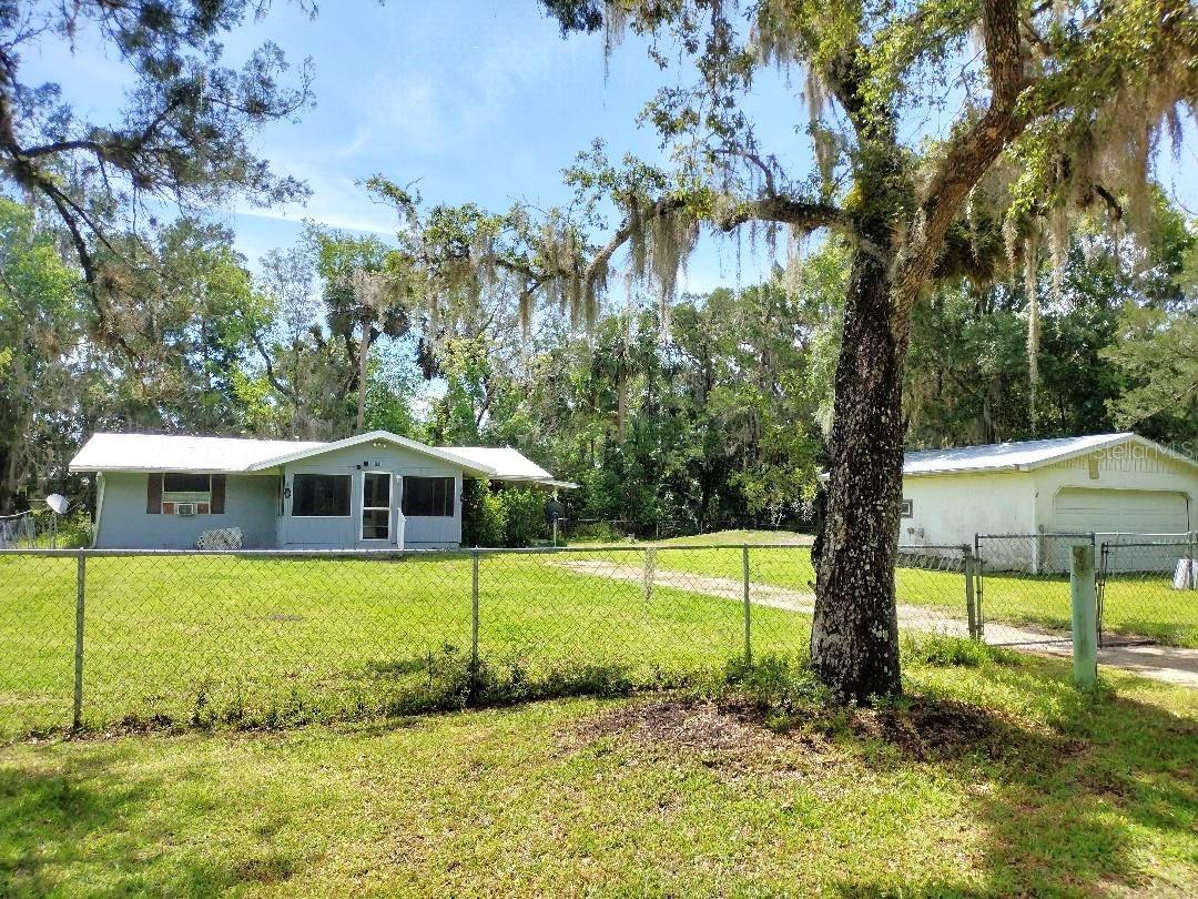 3 Bedroom Singlewide with Additions, Garage, Fenced Yard – Walk to Bull Creek – Cash Only!
Don’t miss this affordable 3 bedroom, 1 bath 1974 singlewide manufactured home with functional additions and desirable upgrades—just a short walk to Bull Creek, known for its excellent freshwater fishing, boat launch, and docks! This home offers a spacious living room, an open kitchen, and a dining room with sliding glass doors that lead to a covered patio—perfect for relaxing or entertaining. Enjoy the Florida lifestyle from your screened porch, ideal for morning coffee or evening gatherings. Set on a 100'x120' fully fenced lot, there’s plenty of space for pets, gardening, or storing outdoor toys. A detached 2-car garage provides extra storage or workshop potential. Enjoy long-term value with a metal roof just 6 years old and a central heat & air system only 7 years old. This is a cash-only opportunity with loads of potential for investors, snowbirds, or anyone looking for an affordable home near the water. Walk to Bull Creek and enjoy the best of country living with convenient access to outdoor recreation. Sold As-IS, Seller doesn't have the mobile home title. Call today to schedule your private showing!