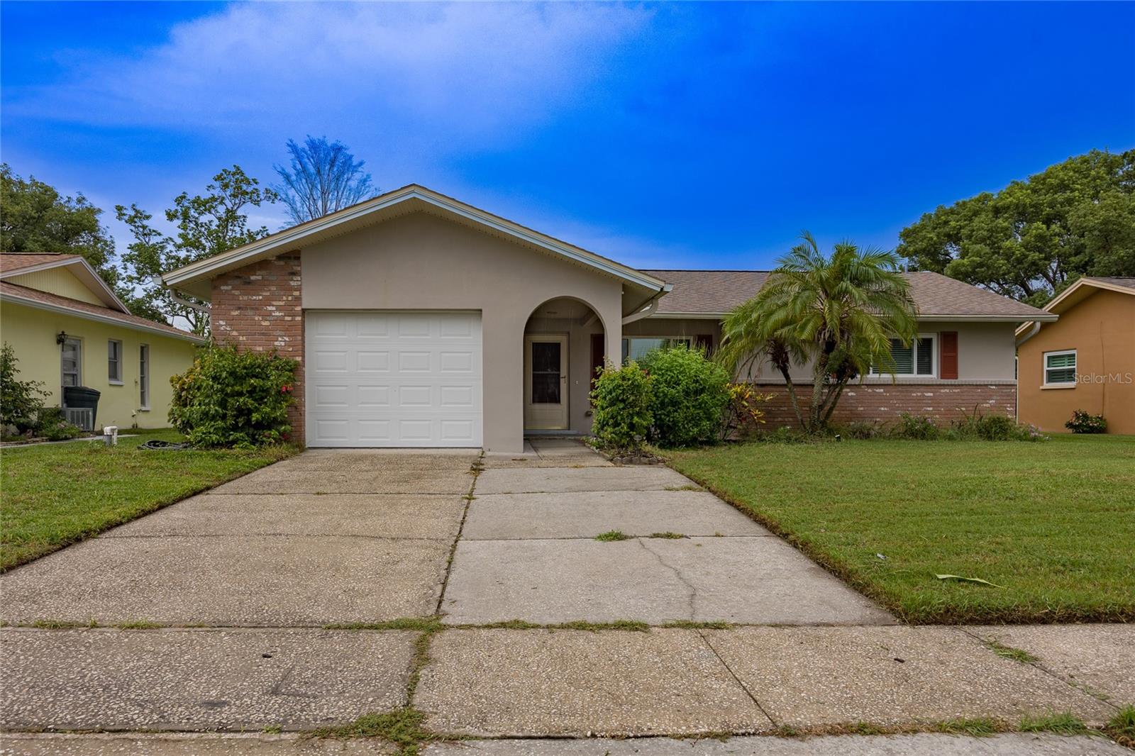 Welome to this beautifiul updated Highland Lakes Beauty!! This over 55+ community offering tons of activities to include olympic sized pool, second pool at the Lodge on Lake Tarpon with boat launch, dock and Lake access, RV and Boat Parking, hot tub, no greens fee 27 hole golf course with unlimited golf, bocce, tennis, pickle ball, shuffleboard, club house, auditorium, dinners & dances, wood shop, ceramics & art studio. Immaculate single family, one story, 2 bedroom, 2 bath, 1 car over sized garage with loads of storage and laundry. Home is renovated with hurricane rated impact windows, all new kitchen with quartz countertops, back splash, luxury vinyl flooring, water softener, Reverse Osmosis Drinking water, ceiling fans in all rooms, additional 150 sq ft enclosed florida room with wall pack AC, windows, screens, tile floors and curtains for added privacy. All this is included in monthly rent with no extra fees. Bring your golf cart and enjoy this "LIKE NO OTHER COMMUNITY IN TAMPA BAY AREA"