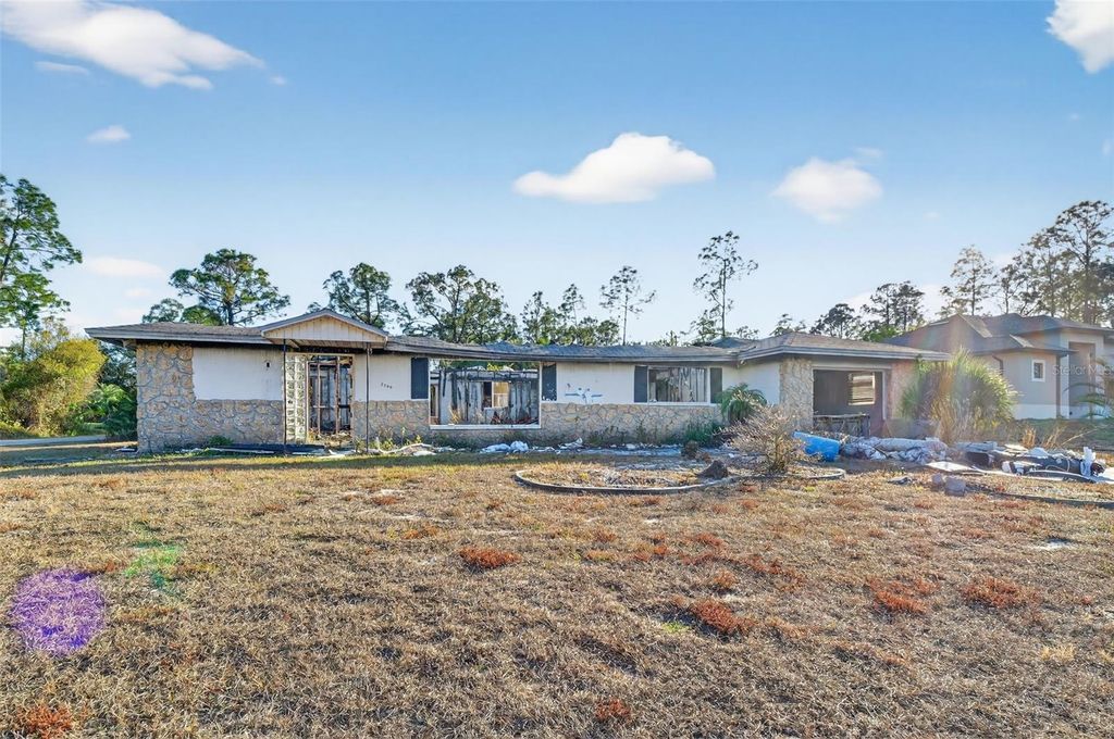 Photo of 2706 E 15th Street, Lehigh Acres, FL 33972 (MLS # O6375340)