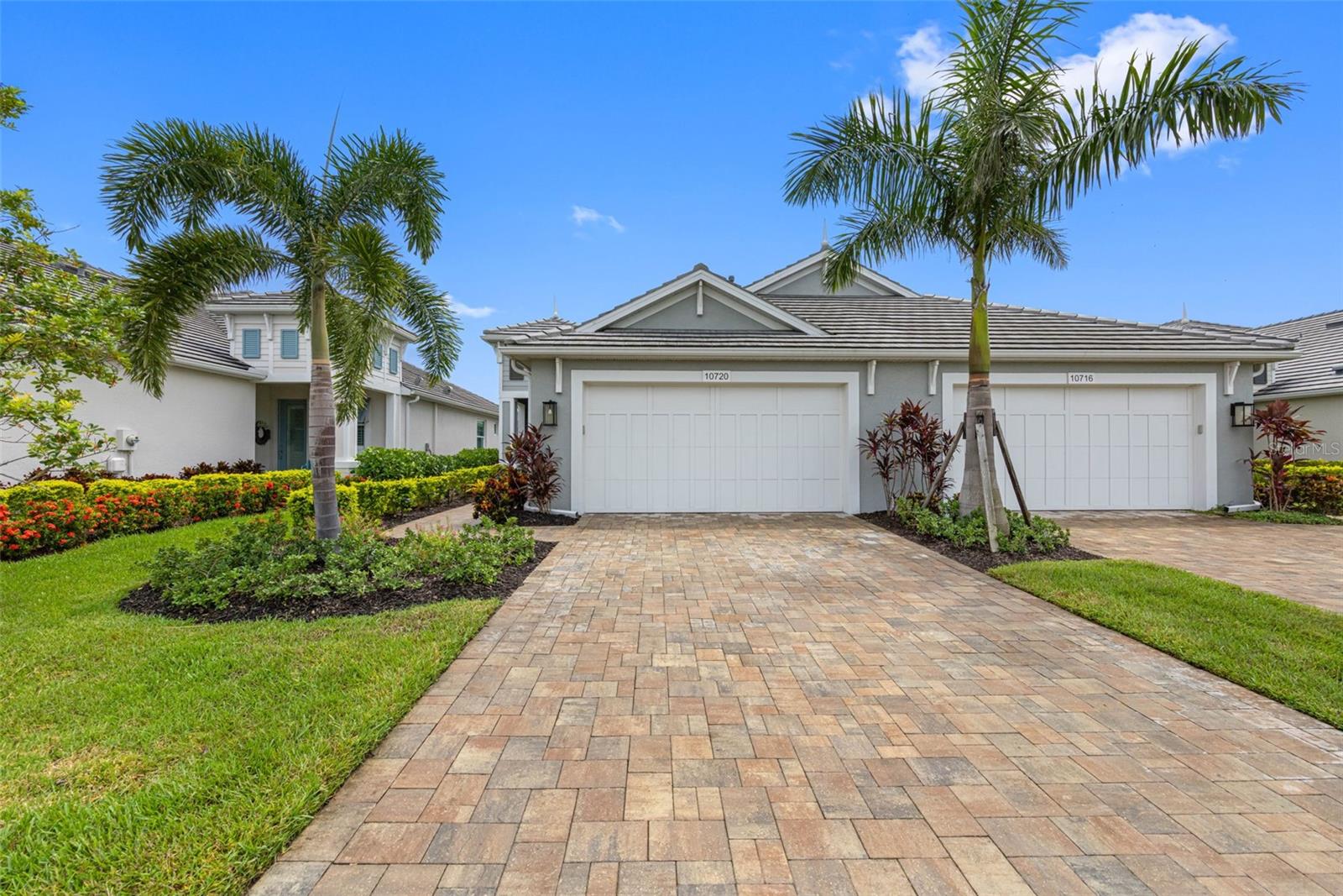 Located within the gated community of Watercolor Place, this 2022-built coastal-style villa perfectly blends modern luxury with low-maintenance living. Built with IMPACT WINDOWS AND DOORS, it offers lasting durability and peace of mind. The exterior showcases a tile roof, paver driveway and sidewalks, and lush tropical landscaping, creating an inviting curb appeal. This desirable Captiva floor plan features 2 bedrooms, 2 baths, a private den with doors, and a 2-car garage. Inside, a light-filled, open-concept design is enhanced by a soothing neutral palette, tray ceilings, plantation shutters, wood-look plank tile flooring, and upgraded ceiling fans throughout. The chef’s kitchen is a true highlight, boasting smart appliances, a gas cooktop with hood, convection oven/microwave combo, quartz countertops, a center island with breakfast bar, and a spacious pantry. The primary suite offers a walk-in closet and a spa-like en-suite bath with dual vanities and a private water closet. Step outside to the screened lanai and take in serene views of the golf course, pond, and wooded backdrop—perfect for morning coffee or evening gatherings. With no CDD fee and an affordable HOA that includes cable, internet, lawn care, and access to recreation facilities, this home provides exceptional value. Community amenities include a clubhouse with pool, spa, and outdoor grilling area, and pickleball enthusiasts will love having the UMR Sports Complex just across the street. Ideally located near I-75, this home offers an easy drive to Sarasota, St. Petersburg, Tampa, and the stunning west coast beaches, with multiple airports also within an hour’s drive. Costco, shopping, brand new Target and dining are just minutes away, putting the best of Florida living at your fingertips. Schedule your private showing today and experience the lifestyle Watercolor Place has to offer!