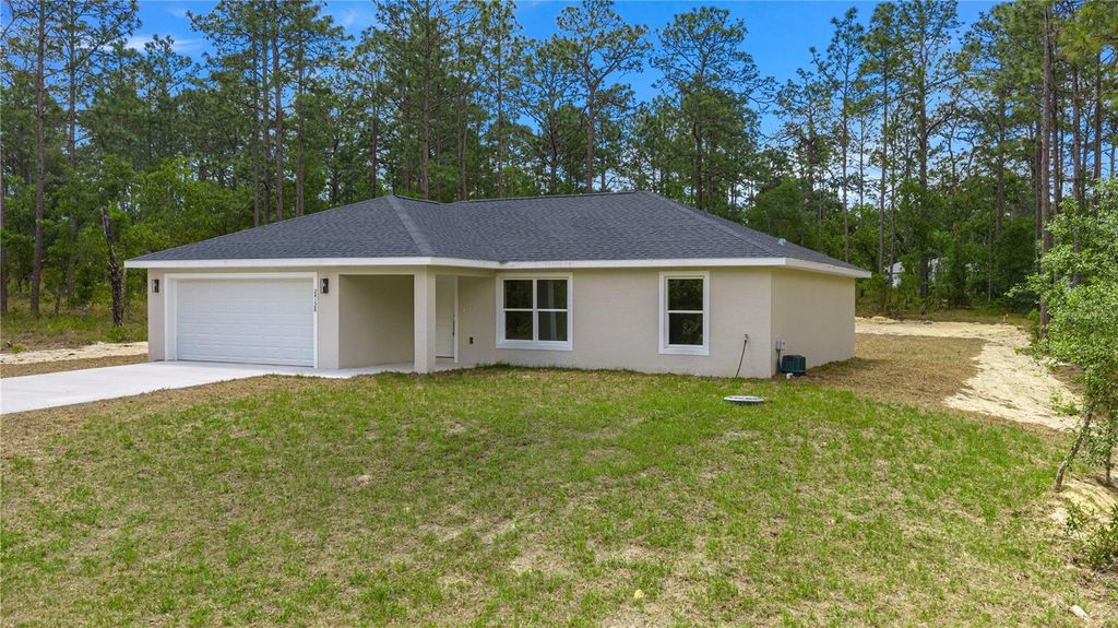 Photo of 22433 SW Rainbow Lakes Boulevard, Dunnellon, FL 34431 (MLS # OM724211)
