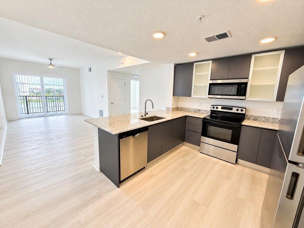Photo of 5591 Millenia Park Boulevard #401, Orlando, FL 32839 (MLS # S5159301)