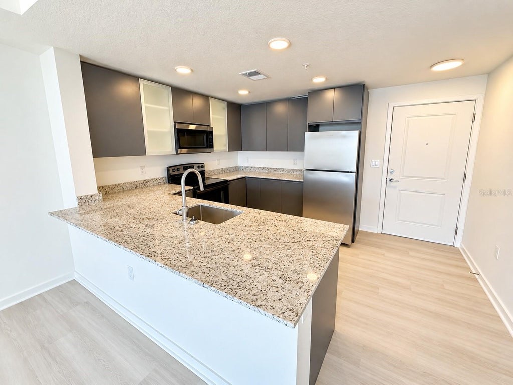 Photo of 5591 Millenia Park Boulevard #401, Orlando, FL 32839 (MLS # S5159301)