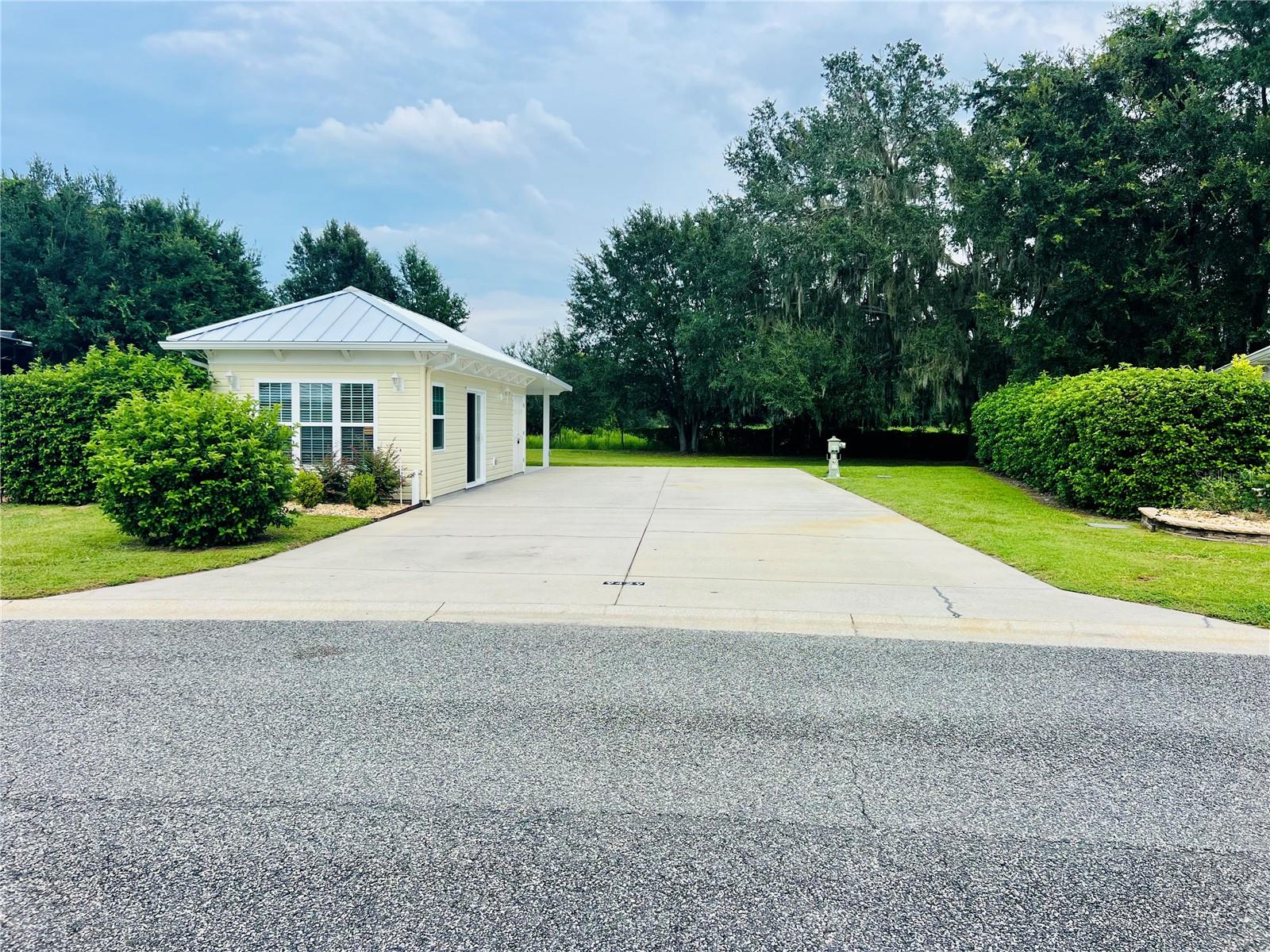 Welcome to Florida Grande Motor Coach Resort Lot 235! This stunning property is set on a huge pie-shaped 6,379 sq ft back-in lot, this property delivers exceptional privacy with live oaks and open pasture views behind. Enjoy outdoor living under the solid surface
pergola with ceiling fan, and park with ease on the 26' x 76' concrete pad with full hook-ups for your Class A or Super C motorhome. The newly completed 384 sq ft Grande Suite features an L-shaped kitchenette with white cabinetry,
white quartz countertops, large sink, beverage fridge, stand-out backsplash, and microwave. Large plank LVP flooring has been installed along with an efficient mini-split air system. A full bath with a vanity matching the kitchenette, walk-in shower makes this beautiful and functional. The rear storage/laundry area is plumbed for a washer/dryer, and a tankless water heater adds modern convenience.
Located in Florida’s friendliest motorhome community just an hour from Ocala, Tampa, and Orlando, you’ll enjoy a full calendar of
activities and a welcoming, resort lifestyle—an ideal home base for exploring Central Florida.
Don't miss one of the standout back-in locations in the resort—move-in ready for you and your coach so you can begin enjoying your new Florida community the first day you arrive.