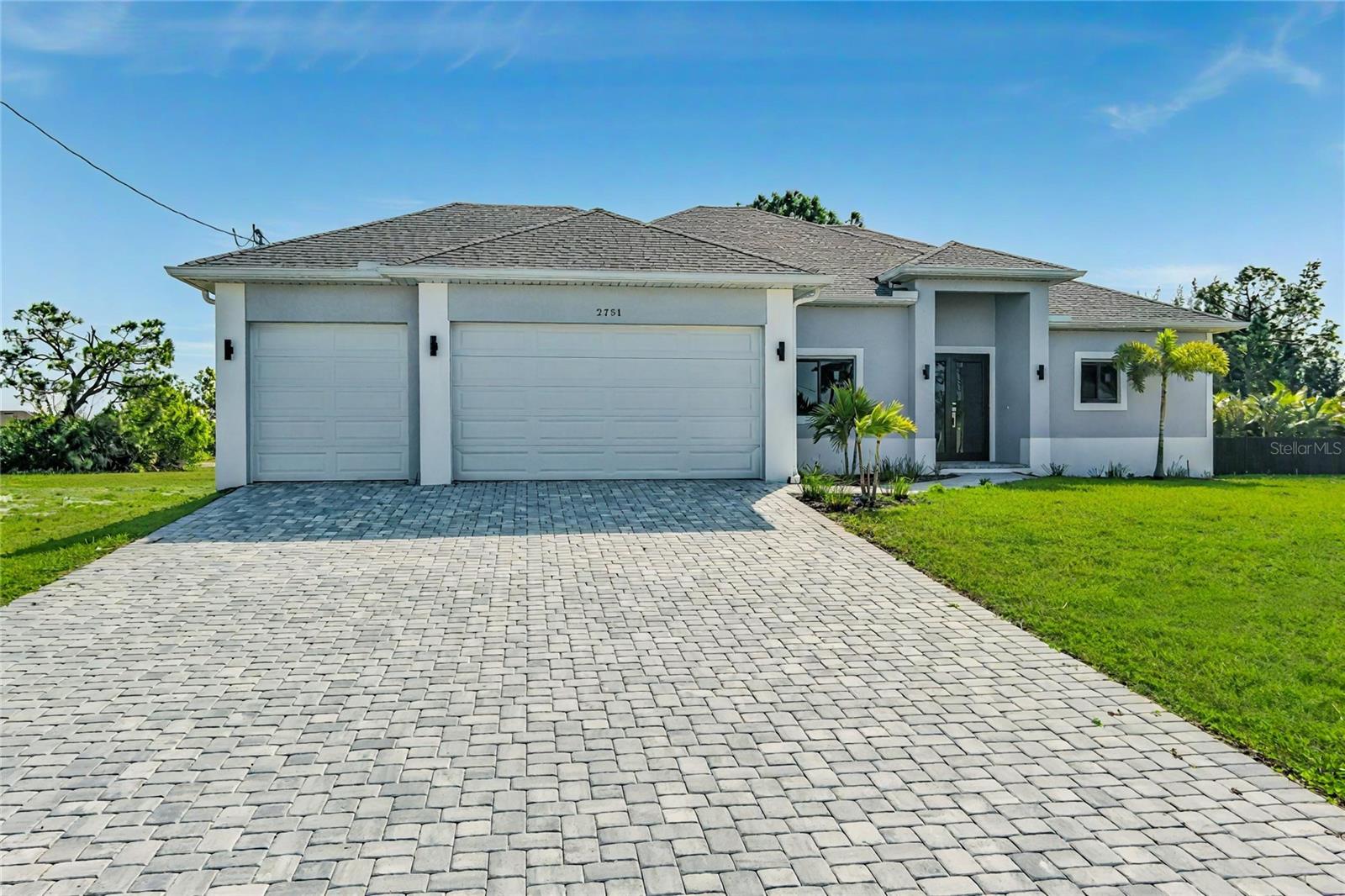 Welcome to Your Dream Home in Cape Coral!* Explore this luxurious new Florence model featuring a spacious 3-car garage, 4 bedrooms, and 3 baths. The open-concept design seamlessly connects the kitchen, living, and dining areas, perfect for entertaining. The chef’s kitchen boasts a stunning quartz island, sleek cabinetry, and top-tier stainless steel appliances. With high ceilings and solid doors, every detail exudes luxury, while generous closet space in each bedroom meets your storage needs. Enjoy the private patio with an outdoor kitchen, ideal for gatherings. Built with hurricane windows and elegant porcelain tile flooring, this home combines style and security. Don’t miss your chance to own paradise in Cape Coral—schedule your showing today.