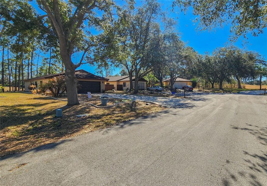 Welcome to this one street boutique community that backs to the 11th hole of the Pine Lakes Golf Course.  Underground utilities for peace of mind during storms.  This home boasts no carpet, a huge great room open to the kitchen and dining space.  Primary and a guest room are down the hallway and a front guest room with a walk in closet makes a perfect office.  Authentic tile roof, a completely fenced yard and a pavered covered screened lanai complete your outdoor living.  HVAC 2018, Fence 2025, 2017 4 windows and sliders replaced.  Come visit this unique little neighborhood and live on the golf course!