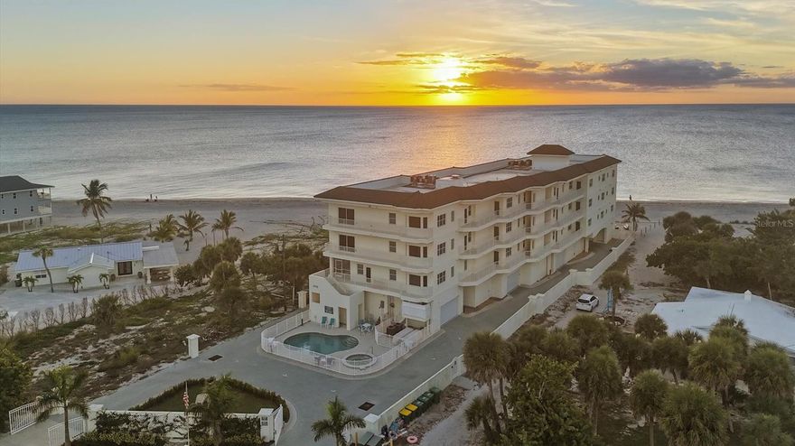 GULF FRONT, DIRECT BEACHFRONT LIVING! Rarely available top-floor residence in the intimate Gulf Island Strand, a boutique building with only 11 units located directly on the sands of Manasota Key. Wake up to breathtaking Gulf views, enjoy morning coffee on your private lanai as dolphins play in the surf, and unwind each evening with stunning sunsets over the water. This beautifully maintained 3-bedroom, 2-bath, plus half-bath condo offers over 1,800 square feet of thoughtfully designed living space with an open floor plan that captures panoramic views from nearly every room. The kitchen has an island and features quartz countertops, updated cabinetry, new appliances, and two pantries, providing exceptional storage and functionality. The living area is ideal for entertaining, complete with 9' tray ceilings, a wet bar, and a spacious lanai that easily accommodates guests. The primary suite is a true retreat with direct lanai access and a spa-inspired en suite bath offering a roman shower, jetted soaking tub, and dual-sink vanity. A split-bedroom layout places two generously sized guest bedrooms near a well-appointed guest bath, while an additional half bath is conveniently located near the foyer. The dedicated laundry room is conveniently located off the kitchen behind a pocket door and features extra storage and a utility sink. This turn key fully furnished residence is move-in ready! Additional features include impact-rated windows and doors, a private 2-car garage perfect for your car and gulf cart, as well as an additional storge room for your beach gear and tools! Gulf Island Strand residents enjoy a heated community pool and spa, fitness room, and a community room with kitchenette and pool table, along with private beach access. Immaculately maintained and ideally positioned, this exceptional beachfront condo offers the very best of island living. Live the dream, your Manasota Key beachfront lifestyle awaits.