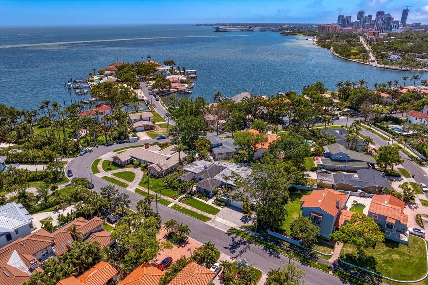 This home stayed high and dry during Hurricane Helene and Hurricane Milton and did not flood.  Welcome to a stunning tropical sanctuary nestled in the prestigious Snell Isle community of vibrant St. Petersburg. This remarkable one-level residence spans 3,969 square feet on a generous double lot, offering an exceptional blend of luxury, comfort and sophisticated style. Along the esteemed Brightwaters Boulevard, the home features three spacious bedrooms, three full baths and two convenient half baths. As you enter through the grand foyer, you are welcomed by an airy open floor plan adorned with high ceilings, exquisite hardwood floors and custom plantation shutters that beautifully frame the picturesque surroundings. The intimate kitchen is a culinary dream, equipped with premium appliances, including a Sub-Zero refrigerator, catering to all your cooking needs. The cozy living room exudes charm with its gas fireplace and elegant details. Adjacent to this space, the great room offers a setting for movie nights or game days, complemented by professional decor, a large-screen TV and a stylish dry bar. The luxurious primary suite is a retreat, complete with a walk-in dressing room and a spa-like bath featuring dual vanities, a soaking tub and a separate shower. Designed with privacy in mind, the thoughtful split floor plan includes two additional bedrooms, each with their en-suite baths, making it an ideal layout for guests or family members seeking their sanctuary. A versatile space is also available to accommodate a home office or workout area. The spacious Florida room overlooks the expansive saltwater pool, an oasis for relaxation and entertaining. Step outside to the beautifully landscaped fenced yard, creating an unforgettable backdrop for lively gatherings around the fire pit. The covered patio includes a Paradise Island grill and a screened-in lanai, providing ample room for poolside seating and alfresco dining. An outdoor TV and a convenient pool-access half bath ensure this space is your slice of paradise. With a generous poolside room accessible from various points, including an oversized garage with additional storage and a cedar closet, you’ll have everything needed for effortless outdoor enjoyment. Enhanced by newly installed HVAC units, a tankless water heater, a generator and stylish recessed lighting throughout, this home exemplifies modern comfort. Mere minutes from the Vinoy Golf Course and a short drive to downtown St. Petersburg. This property provides easy access to an array of upscale boutiques, cultural landmarks and dining experiences, serving as your gateway to the vibrant lifestyle of downtown St. Petersburg. Don't miss this extraordinary opportunity to own a remarkable home on Snell Isle so schedule a showing today and experience the luxurious lifestyle that awaits you on Brightwaters Boulevard!